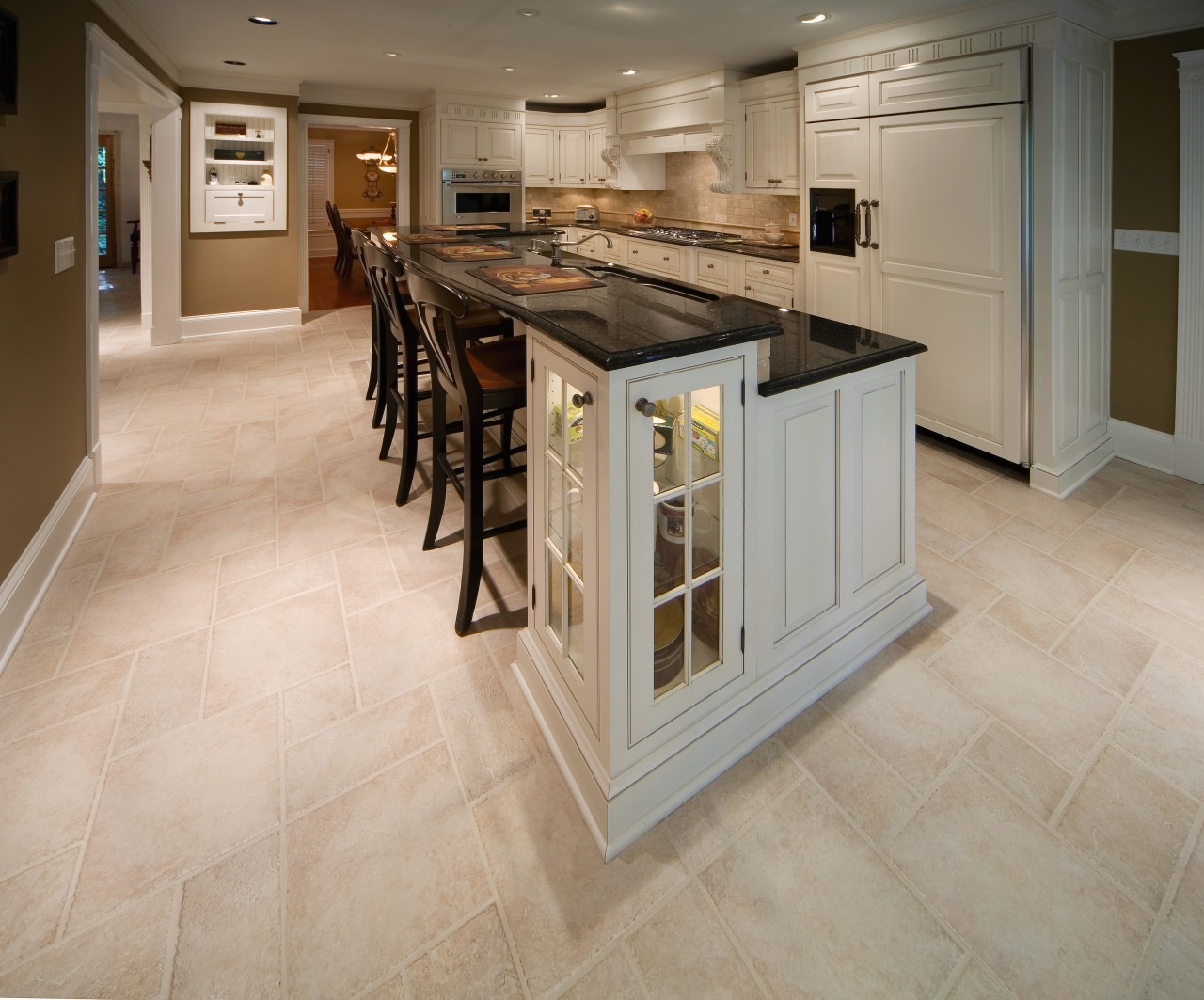 A view of a kitchen by Kitchenworks. cabinetry, countertop, cuisine classique, floor, flooring, hardwood, kitchen, laminate flooring, tile, wood flooring, gray, brown