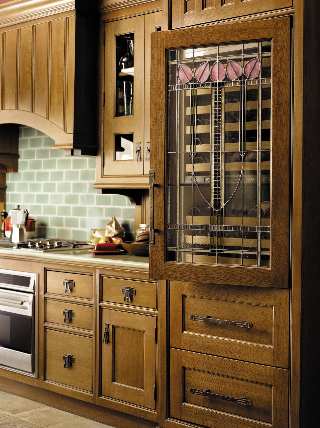 view of this kitchen featuring stainless steel wolf cabinetry, countertop, cuisine classique, furniture, home appliance, kitchen, brown