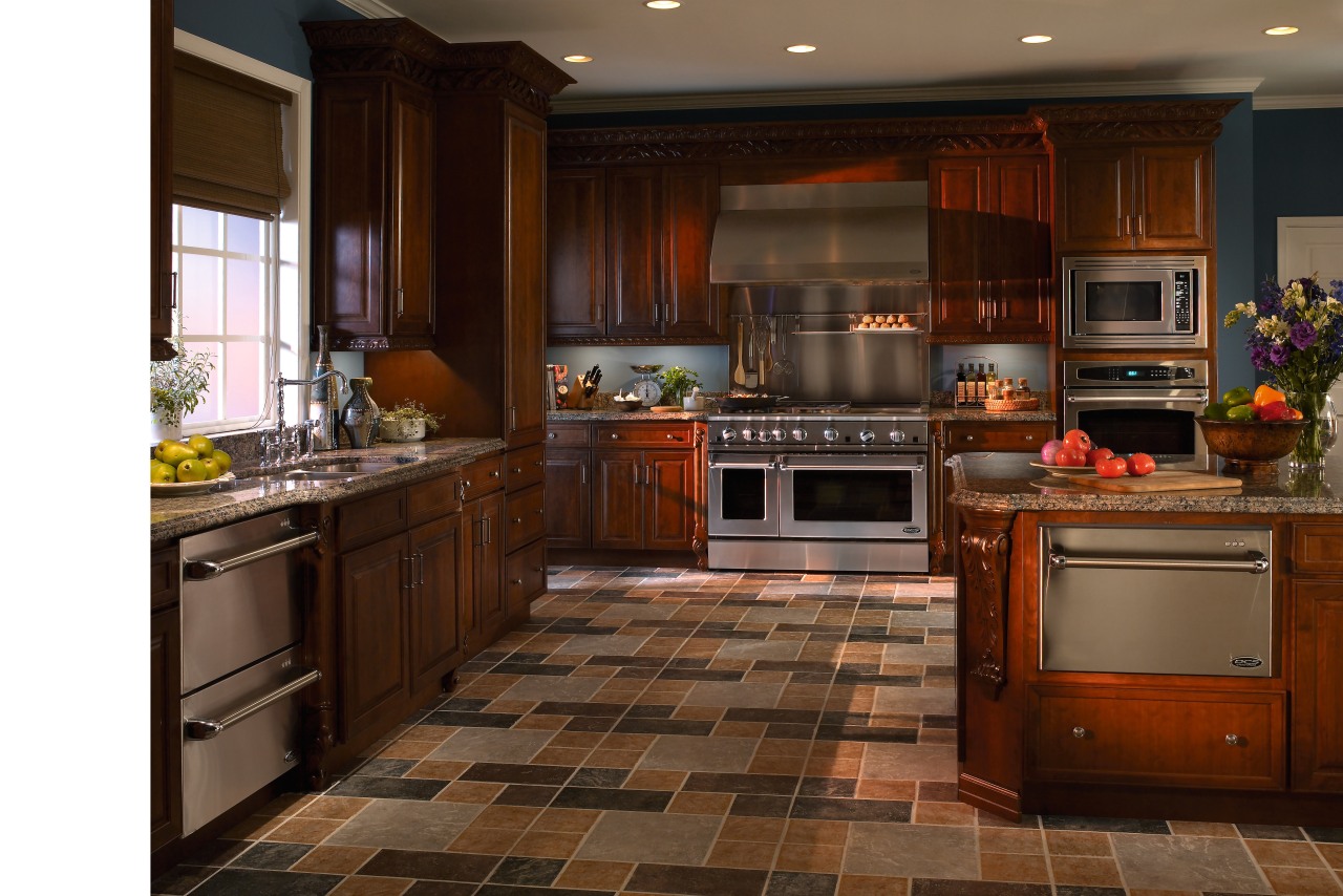 view of the kitchen featuring a DCS stainless cabinetry, countertop, cuisine classique, floor, flooring, hardwood, interior design, kitchen, room, wood flooring, brown