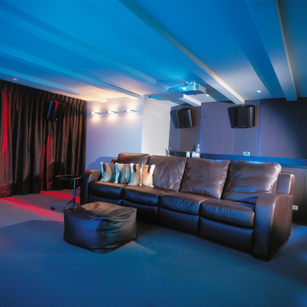 view of the theatre featuring brown leather furniture, blue, ceiling, home, interior design, lighting, room, blue