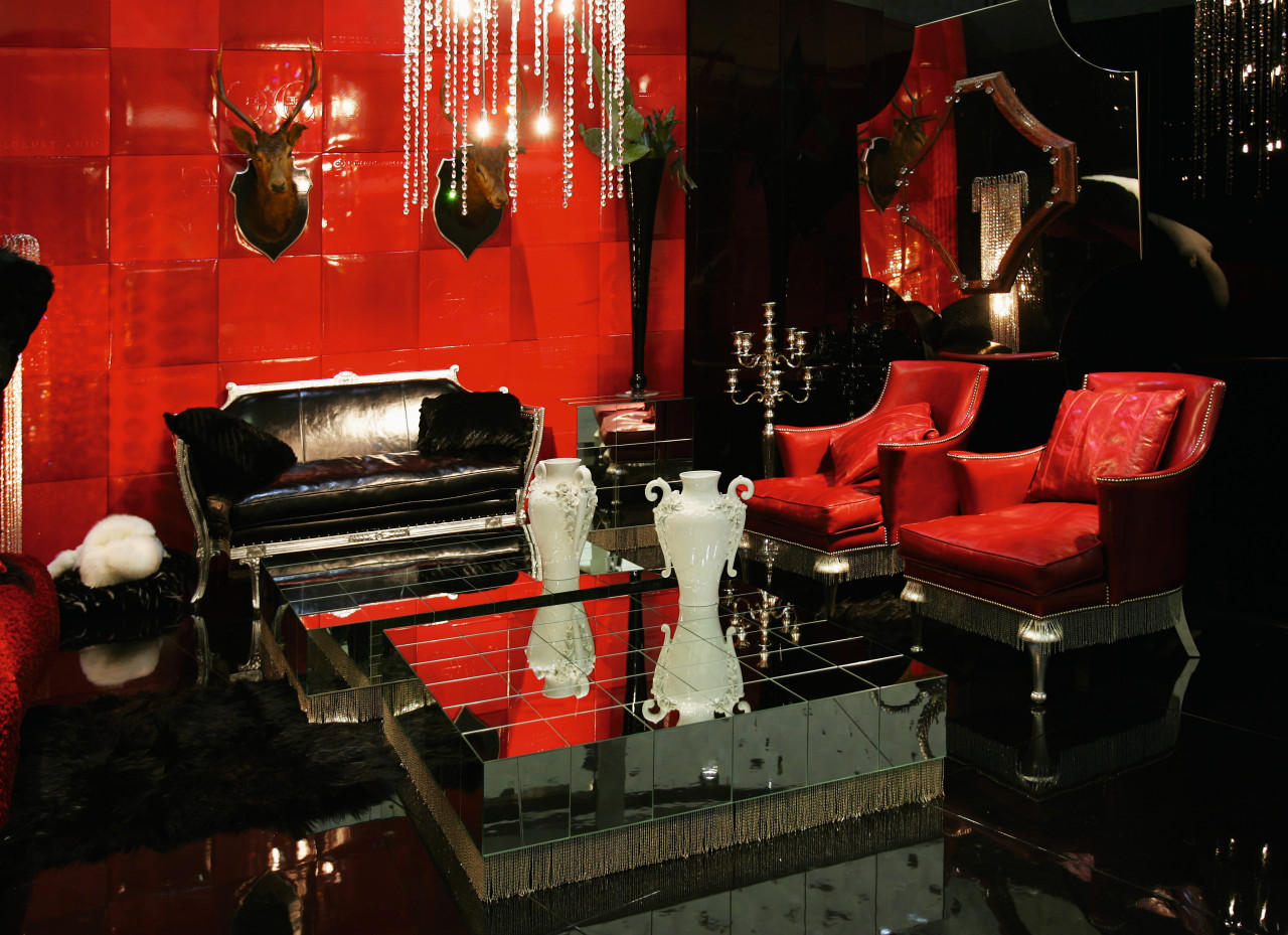 view of the living area featuring red and furniture, interior design, lighting, living room, room, black, red