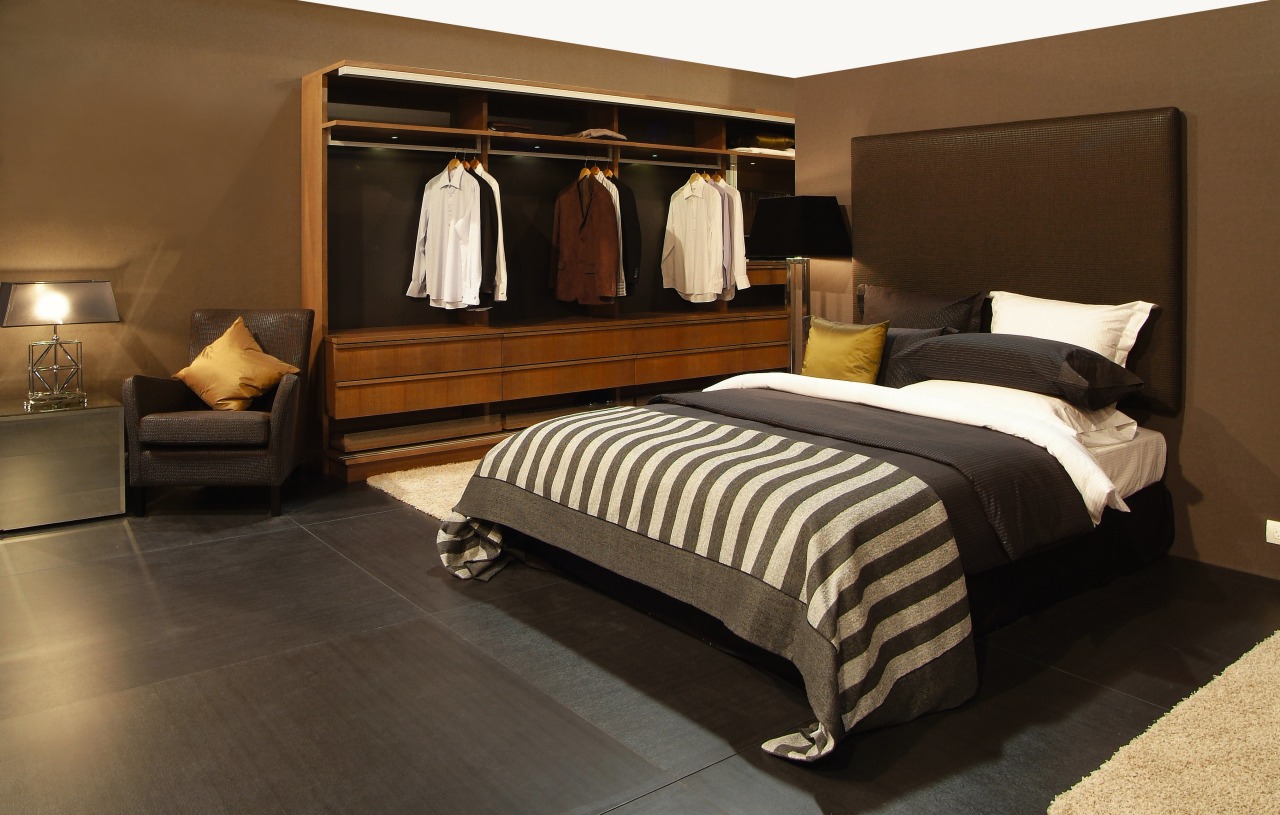 view of the master bedroom featuring timber veneer bed, bed frame, bedroom, floor, flooring, furniture, interior design, room, suite, black, brown