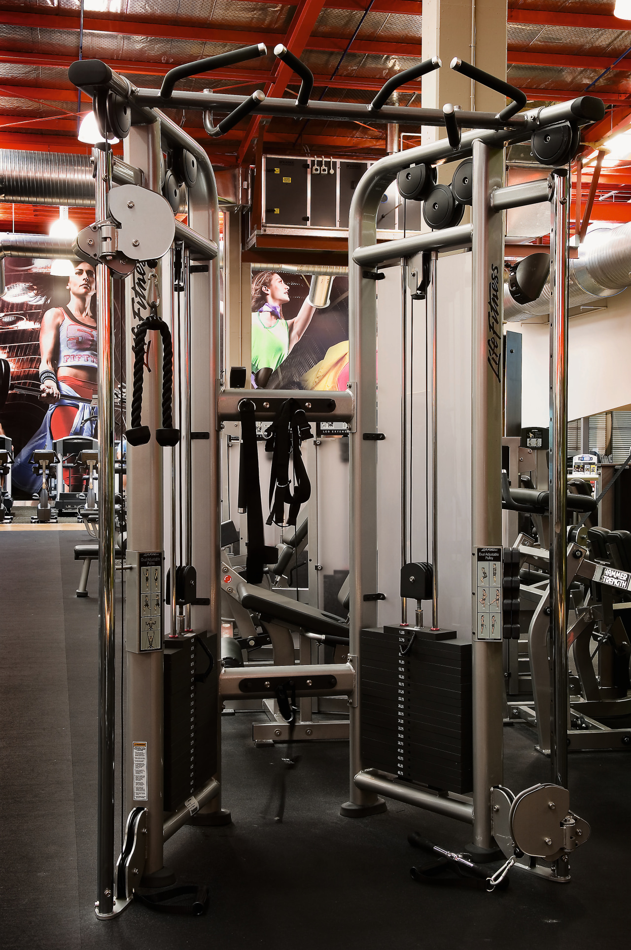 A view of some fitness equipment from Life exercise machine, gym, room, sport venue, structure, weight training, black, gray