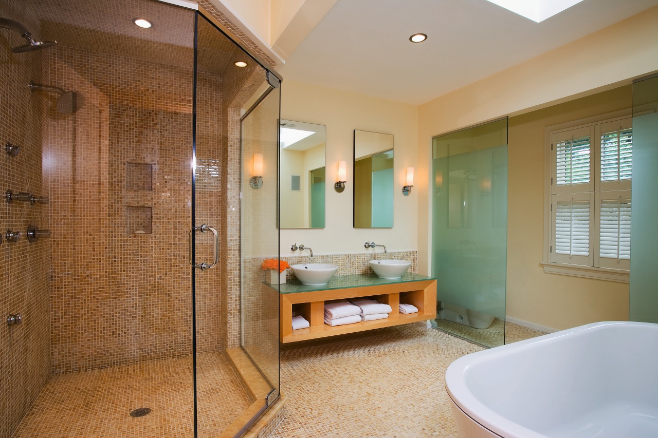 A view of the Bathroom featuring tiled flooring/walls, bathroom, ceiling, estate, floor, home, interior design, real estate, room, tile, brown, gray