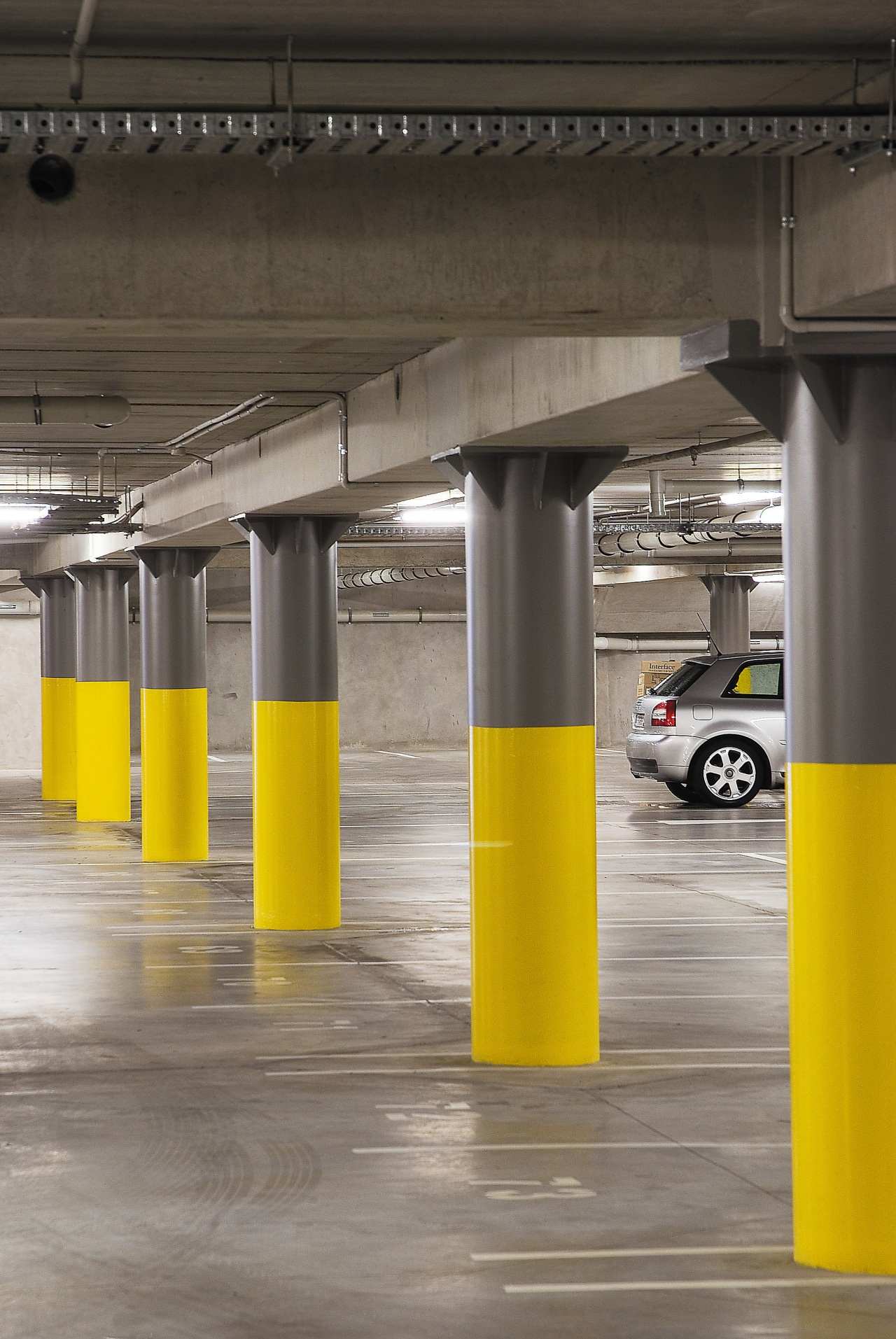 A view of the AirNZ building. parking, yellow, gray, black