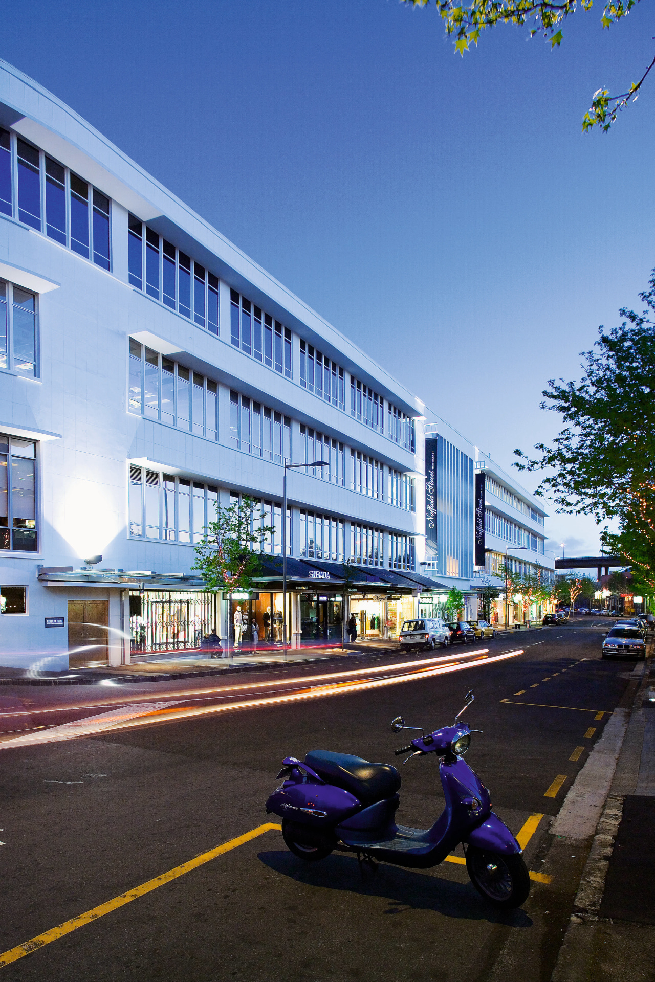 A view of the Nuffield Street Westfield shopping apartment, architecture, building, car, city, commercial building, condominium, corporate headquarters, daytime, facade, headquarters, house, metropolis, metropolitan area, mixed use, neighbourhood, real estate, residential area, road, sky, town, urban area, teal