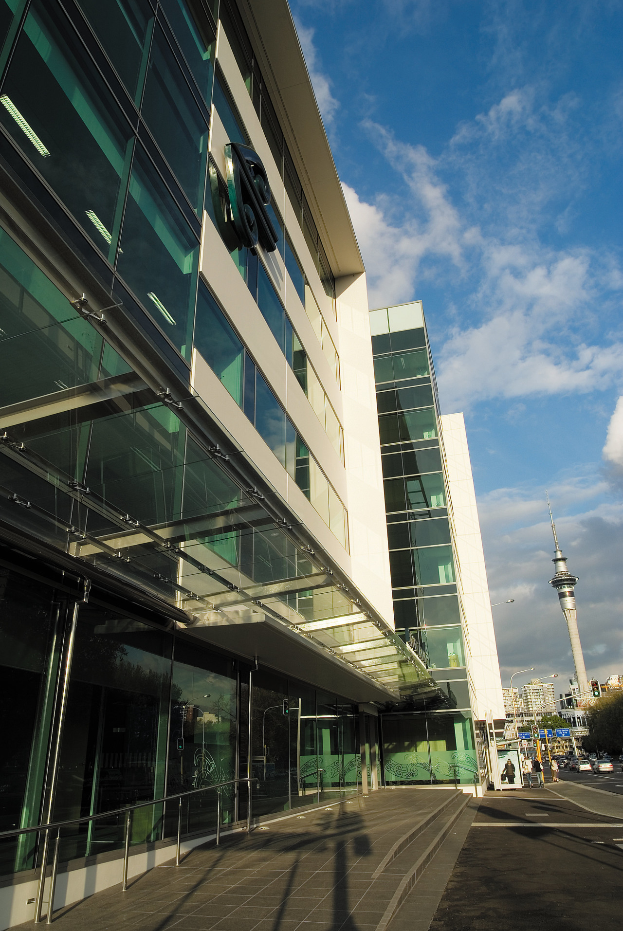 A view of the AirNZ building. architecture, building, city, commercial building, condominium, corporate headquarters, daytime, downtown, facade, headquarters, infrastructure, metropolis, metropolitan area, mixed use, real estate, reflection, residential area, sky, skyscraper, structure, tower block, urban area, black