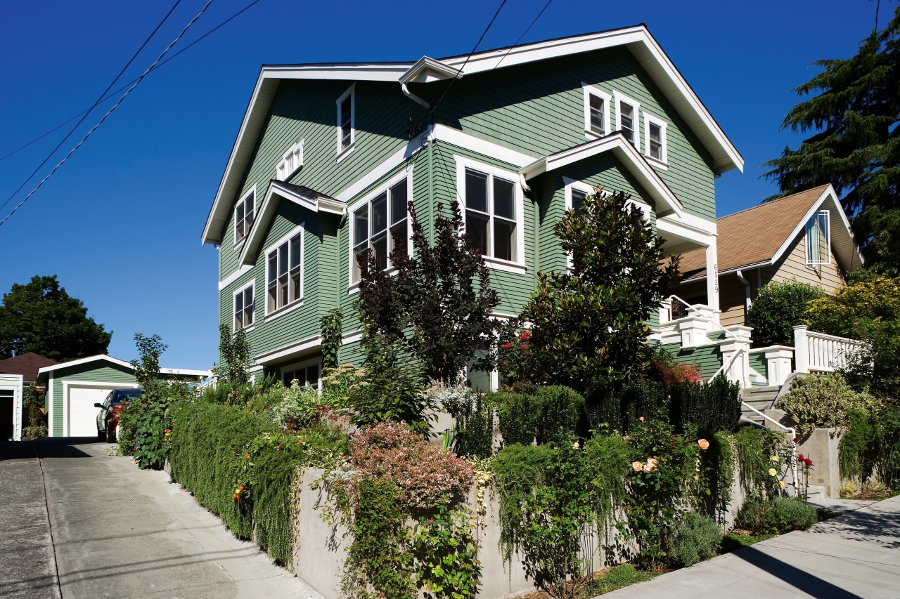 An exterior view of the home. architecture, building, cottage, estate, facade, home, house, neighbourhood, plant, property, real estate, residential area, roof, siding, sky, suburb, tree, window