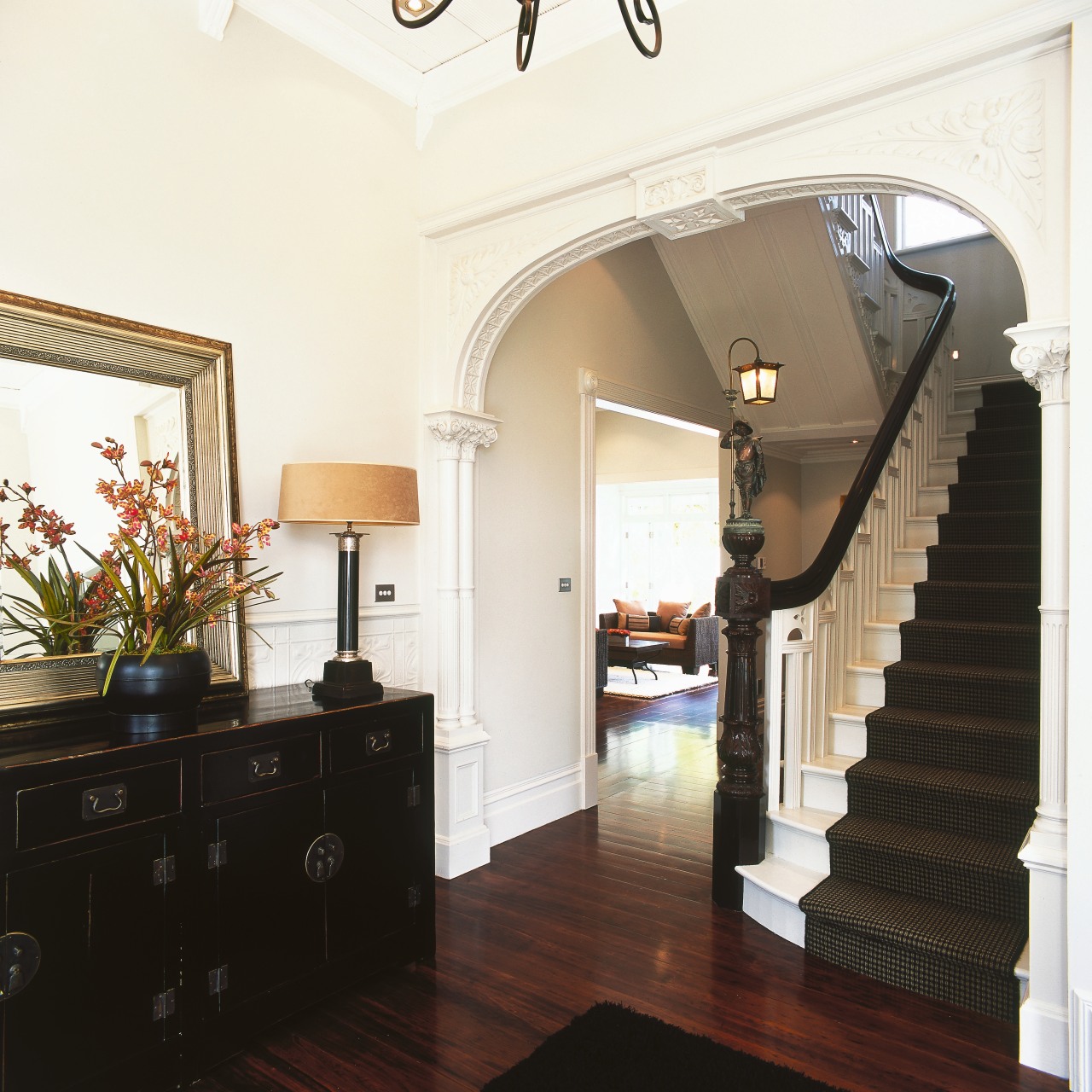 A view of the staircase, wooden flooring, carpeted architecture, ceiling, estate, floor, flooring, hardwood, home, house, interior design, living room, molding, property, real estate, room, stairs, wall, window, white, black