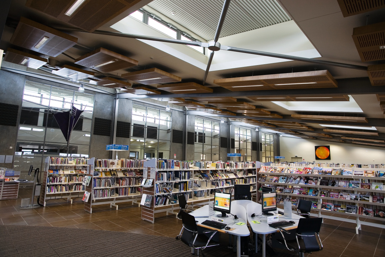 A view of the Papamoa Library. institution, interior design, library, library science, public library, black