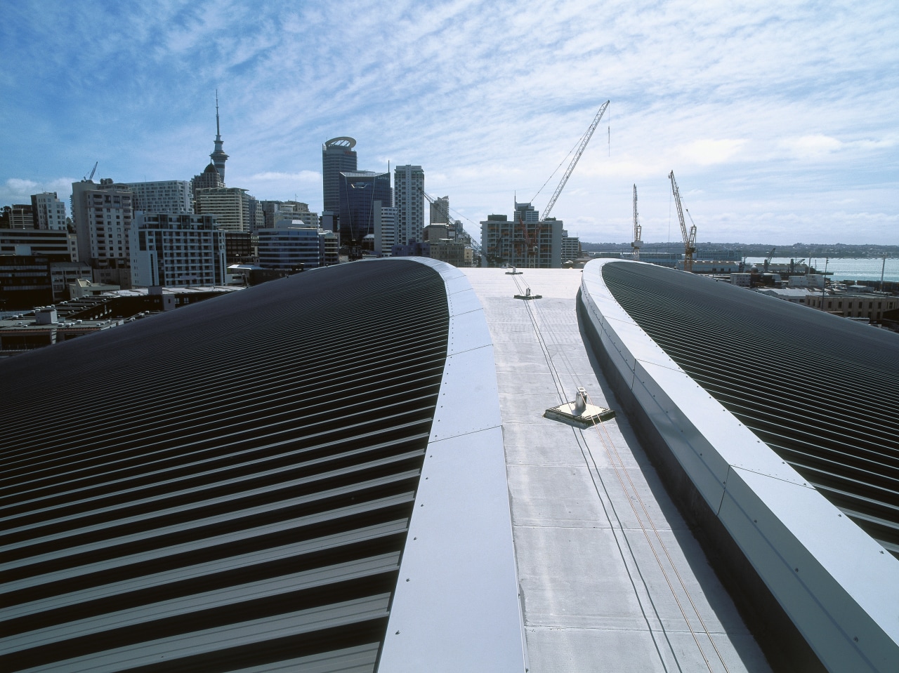 view of the Dimond Dimondek 630 roofing profile architecture, bridge, building, city, condominium, daytime, downtown, fixed link, infrastructure, line, metropolis, metropolitan area, roof, sky, skyline, skyscraper, skyway, structure, tower block, urban area, white, black