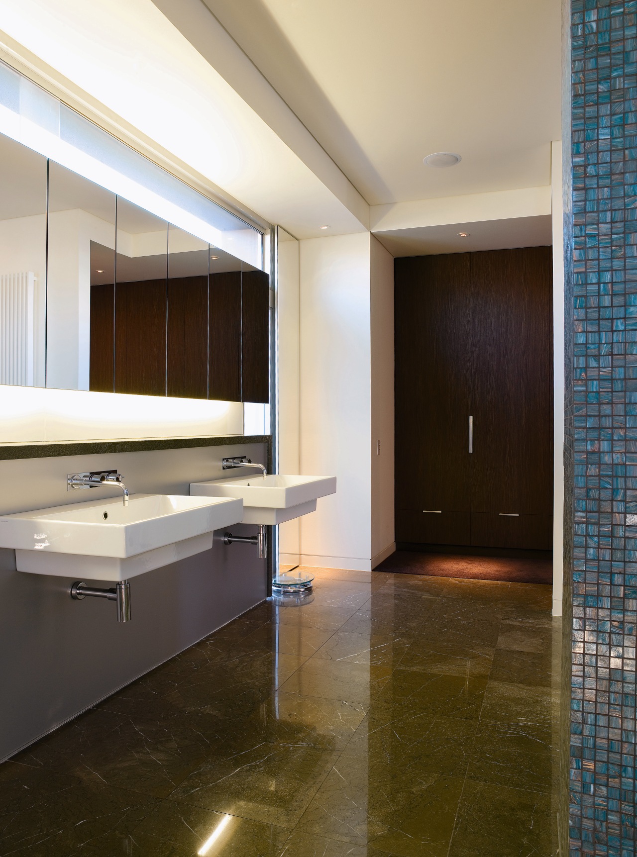 Large wall-hung basins accentuate the size of the architecture, bathroom, cabinetry, ceiling, countertop, daylighting, floor, flooring, interior design, real estate, room, sink, tile, wood flooring, gray, brown