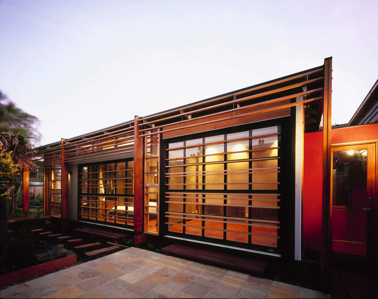 An exterior view of the home. door, facade, home, house, property, real estate, residential area, white, black