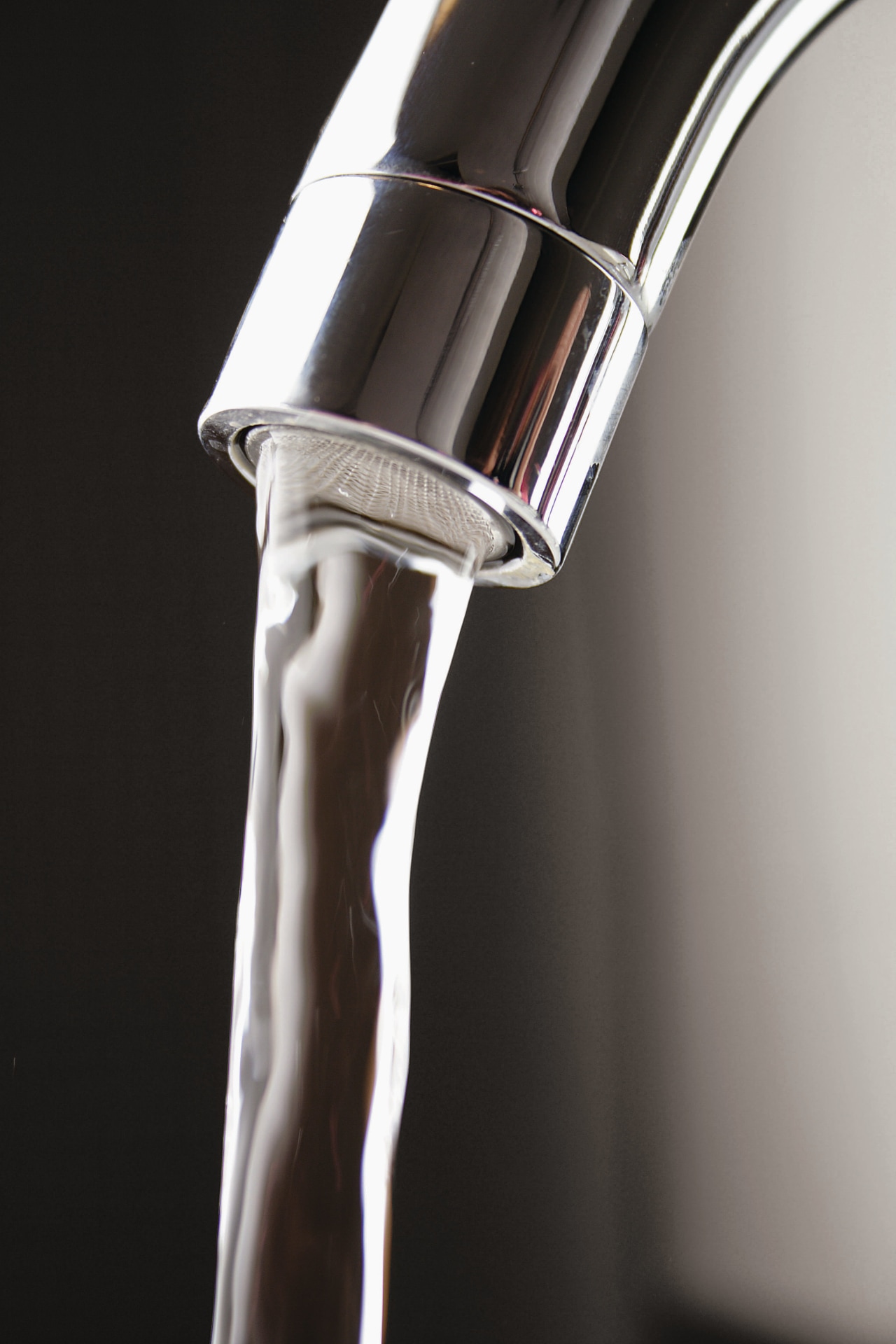 A view of a hot water cylinder from arm, product design, tap, water, black, gray