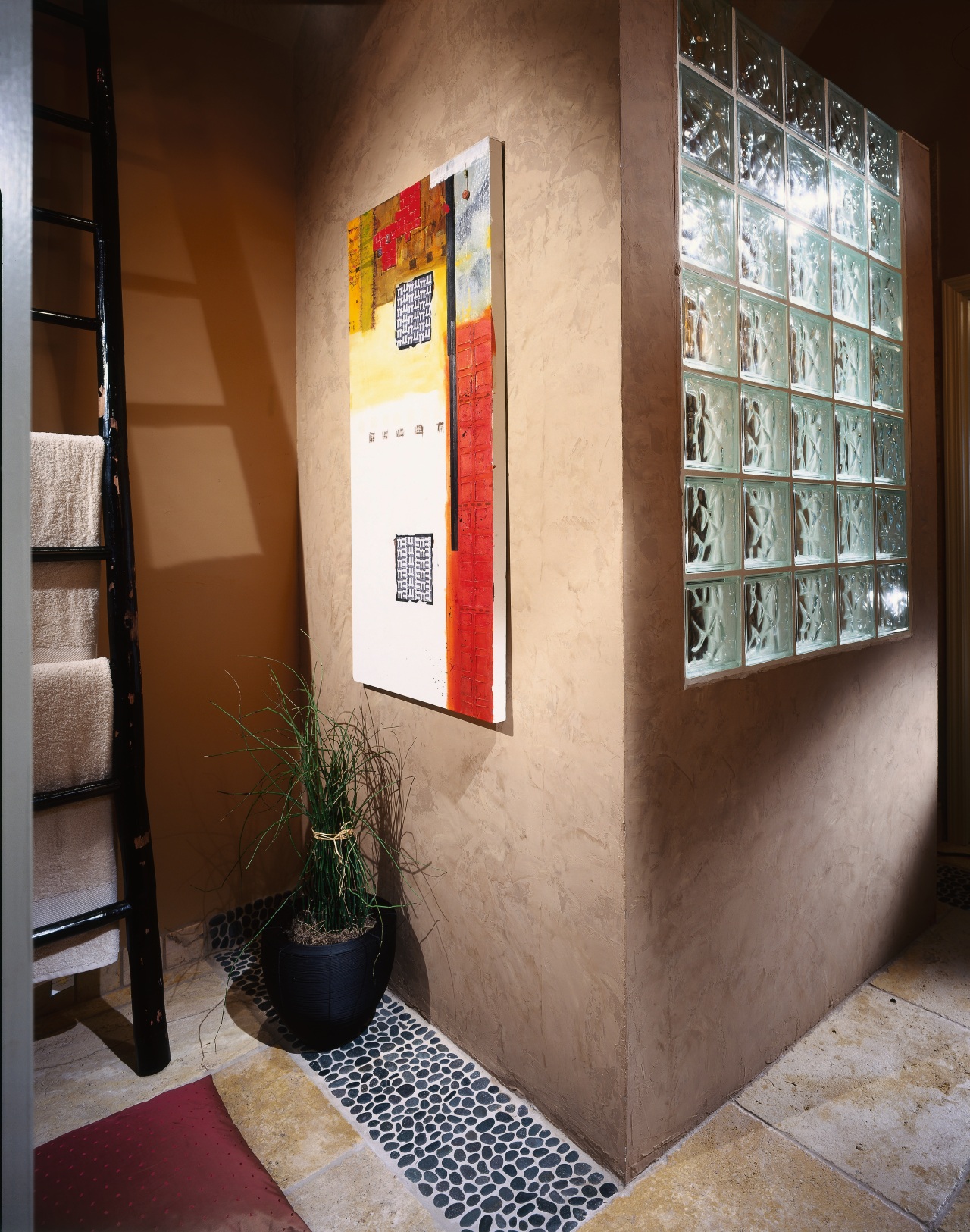 A view of some artwork in the bathroom. furniture, interior design, shelf, shelving, brown, gray