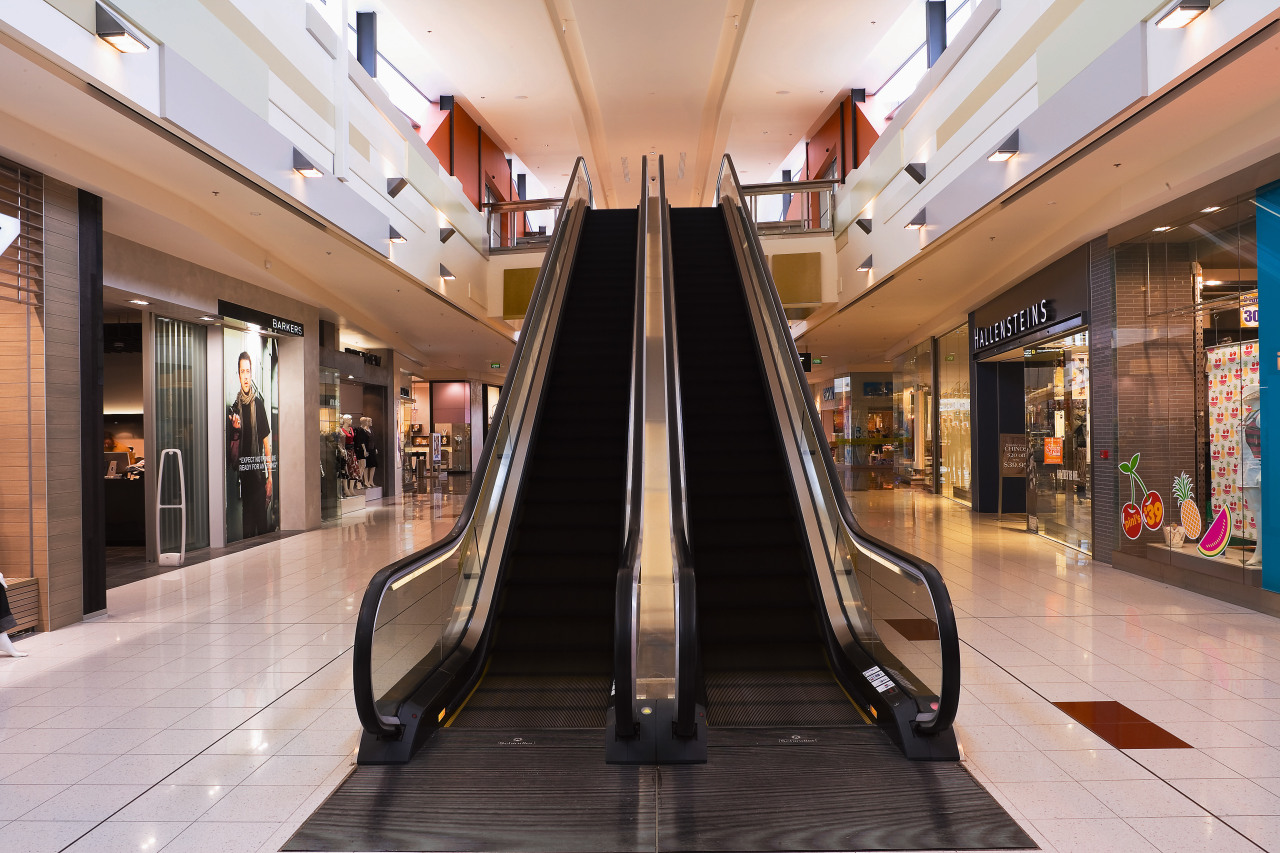 A view of a mechanical feature in Sylvia building, escalator, interior design, lobby, outlet store, retail, shopping, shopping mall, gray, black
