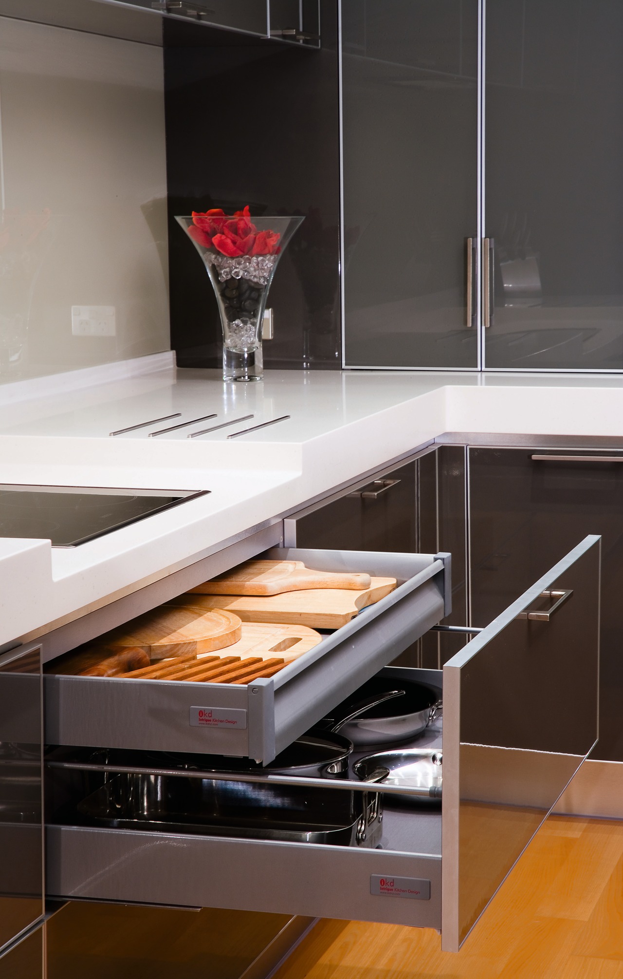 A close up view of the kitchen cabinetry. countertop, floor, flooring, furniture, interior design, kitchen, kitchen stove, product design, sink, table, black