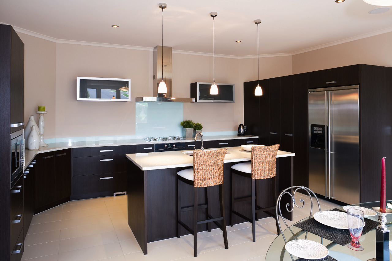 This kitchen features dark chocolate-coloured cabinetry and smeg cabinetry, countertop, cuisine classique, interior design, kitchen, property, real estate, room, gray, black