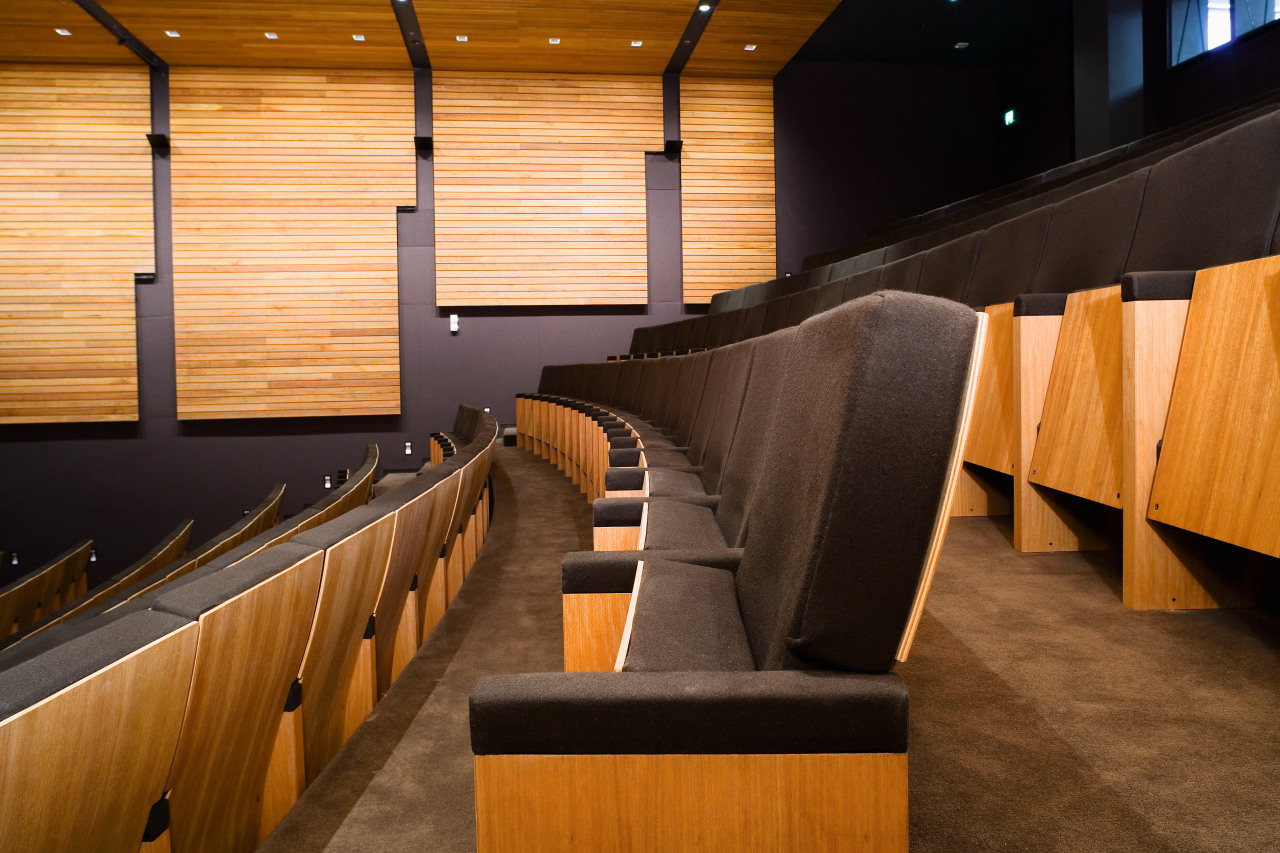 A view of some seating from Civic Seating architecture, auditorium, flooring, furniture, interior design, lobby, wood, brown, orange, black