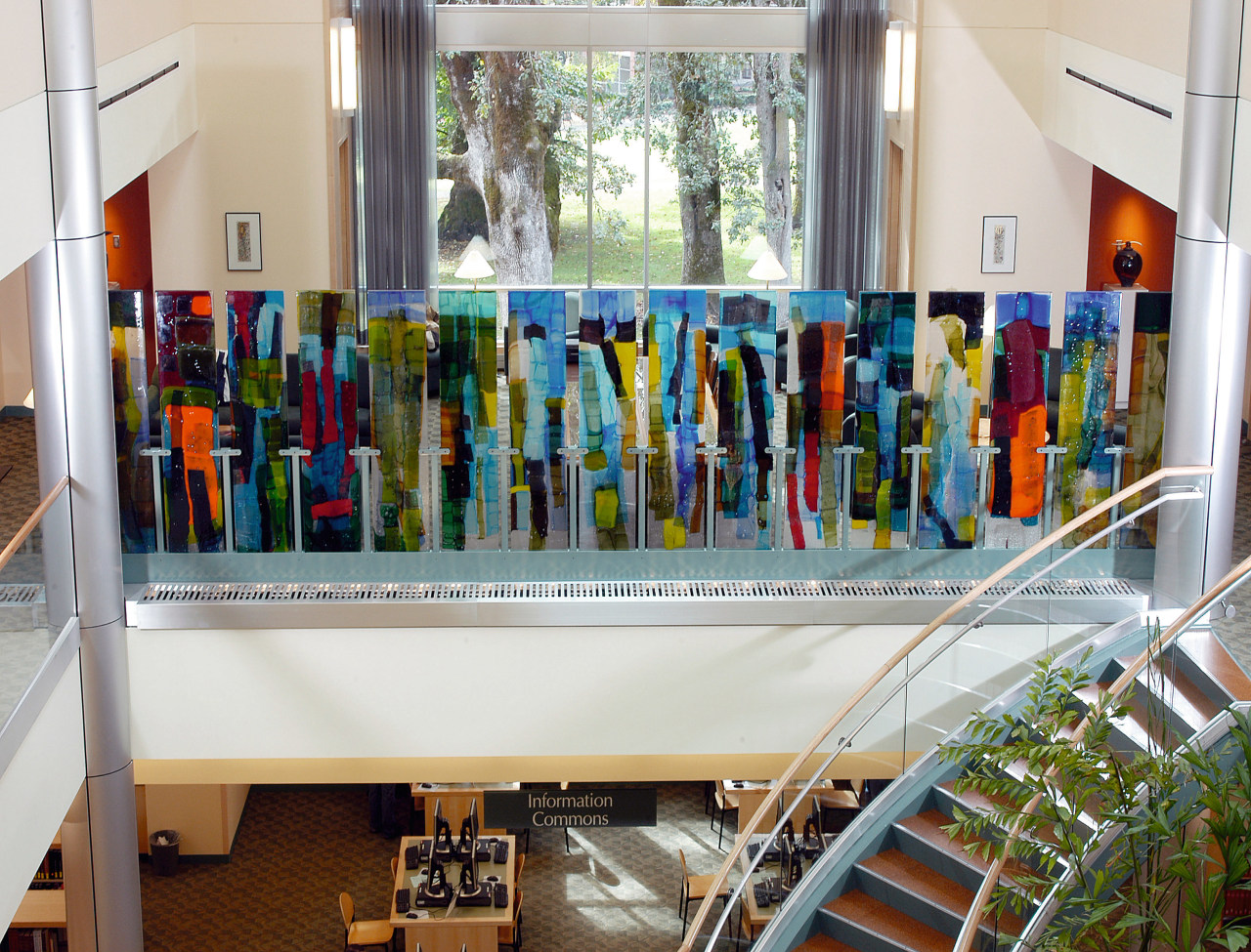 Glass artwall in upper level of a library. white