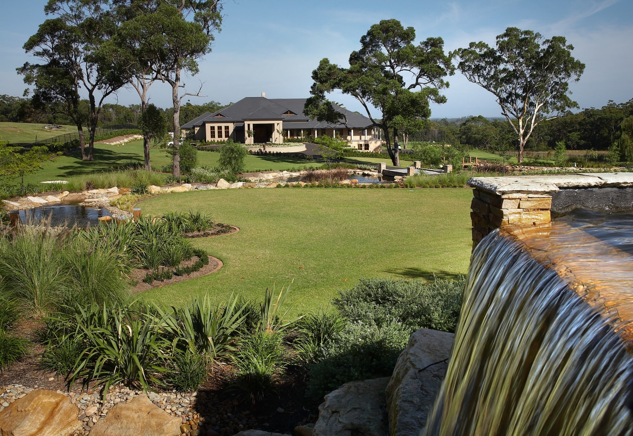 View of the landscaped gardens around the golf cottage, estate, grass, home, house, land lot, landscape, lawn, property, real estate, tree, yard, brown