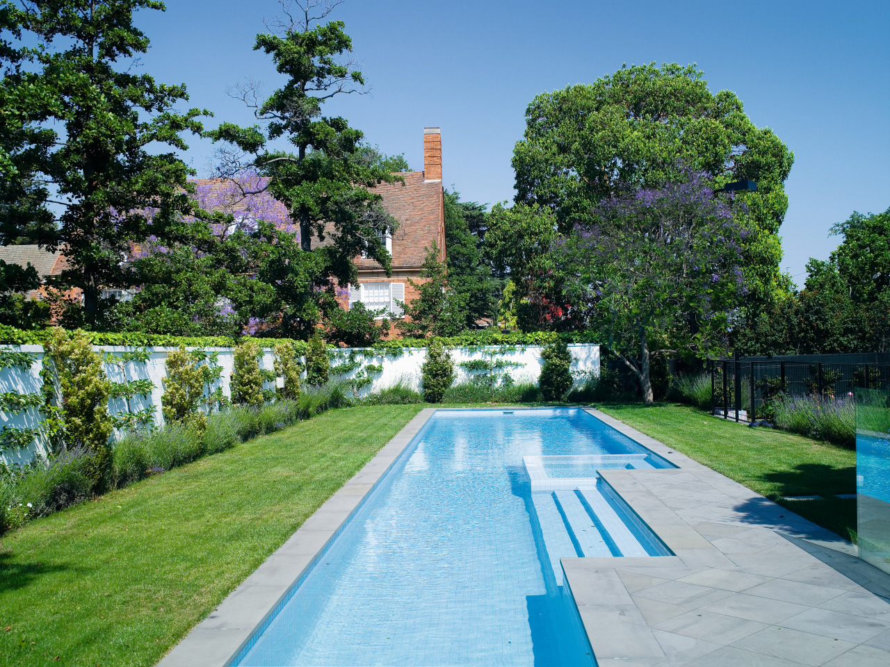 View of the long Pool that features perimeter daytime, estate, garden, leisure, mansion, plant, property, real estate, reflecting pool, reflection, sky, swimming pool, tree, water, waterway, green, teal
