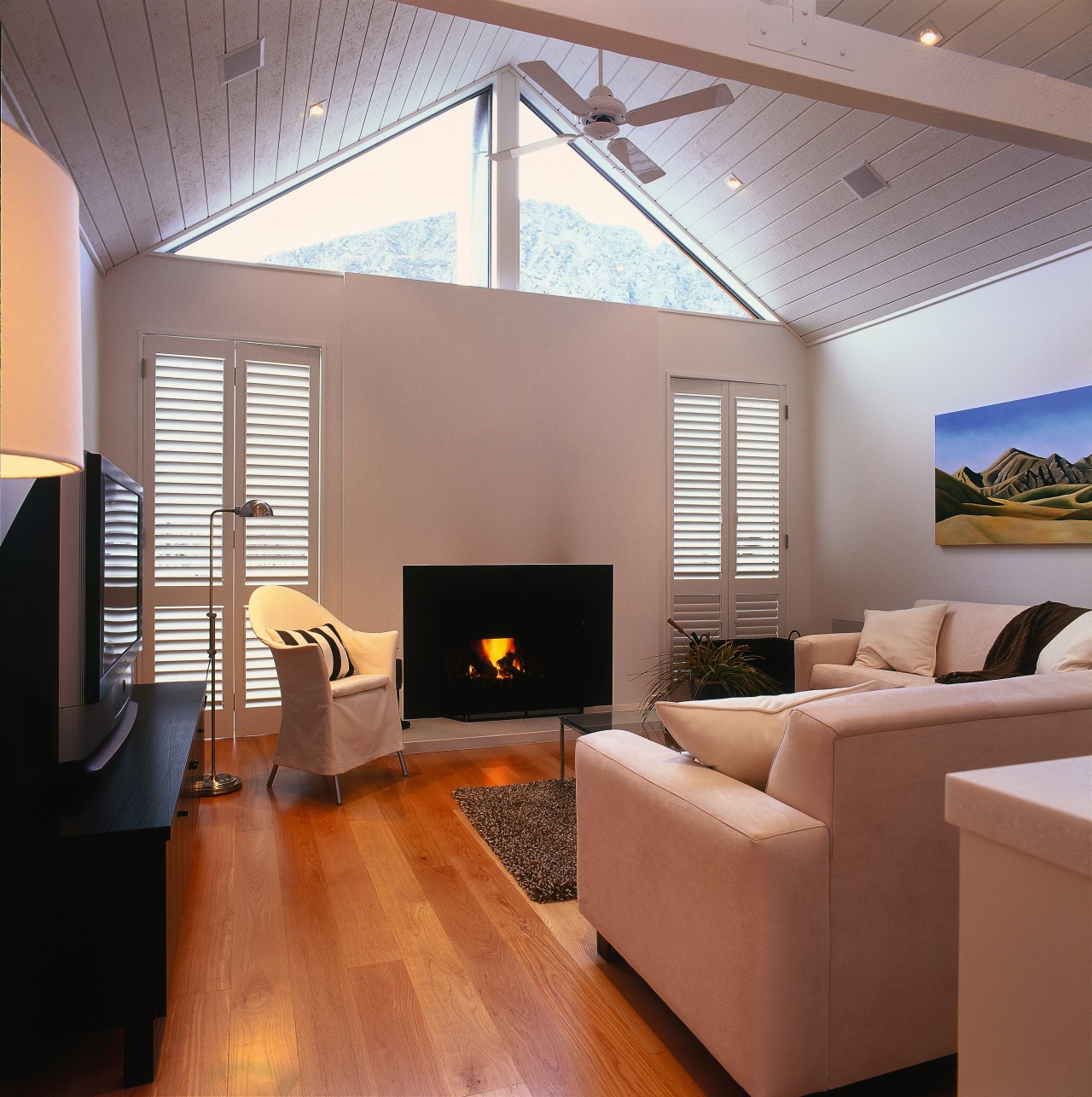 A view of the living area featuring carpet architecture, ceiling, daylighting, floor, flooring, hardwood, hearth, house, interior design, laminate flooring, living room, real estate, room, wall, wood, wood flooring, gray, red