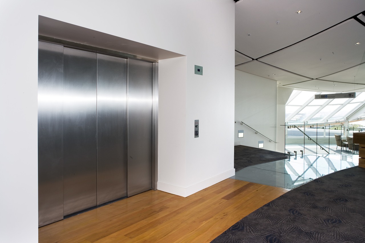 A view of an elevator supplied by Otis architecture, ceiling, door, floor, glass, house, interior design, real estate, white, gray