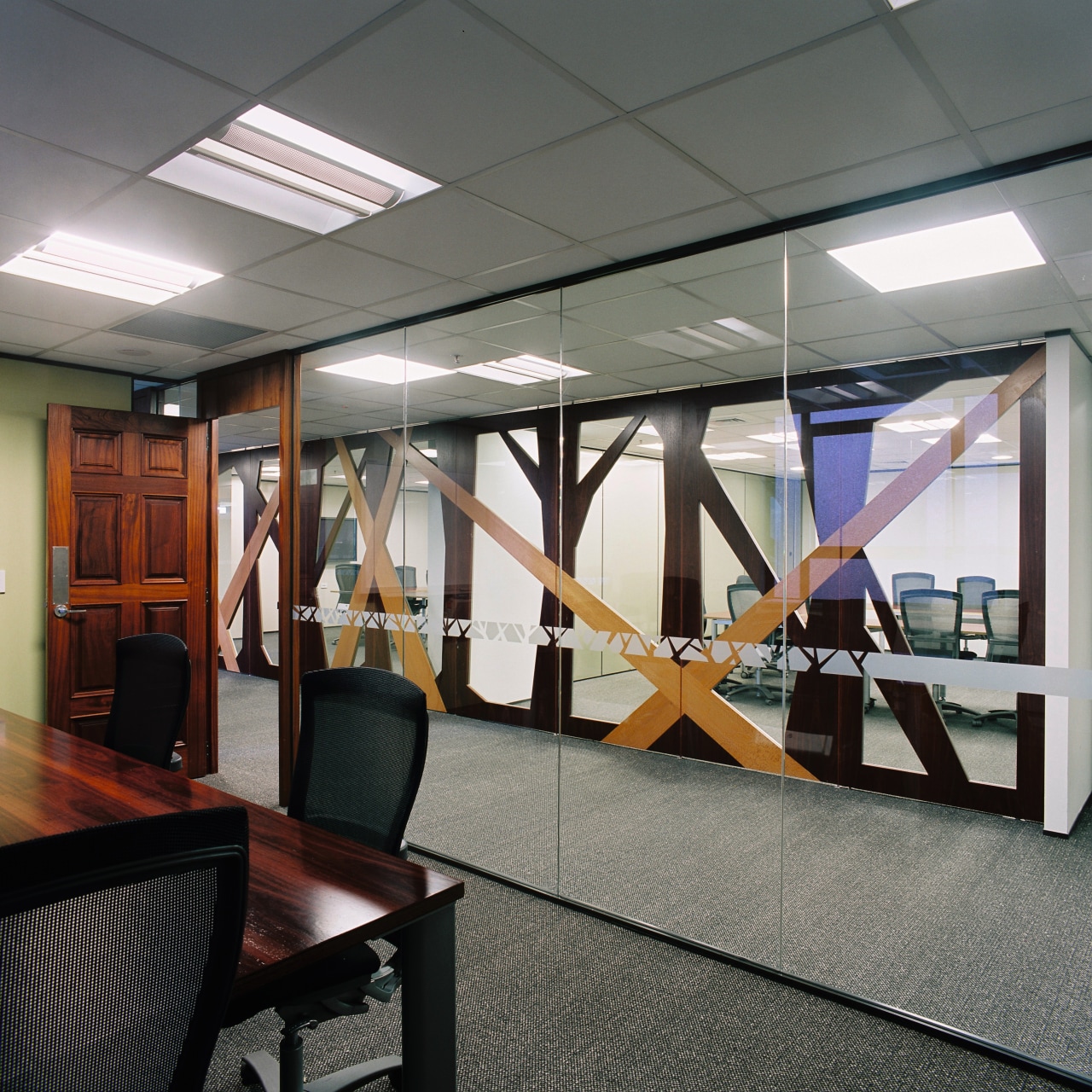 A view of the formal boardroom featuring wood ceiling, glass, institution, interior design, structure, gray, black