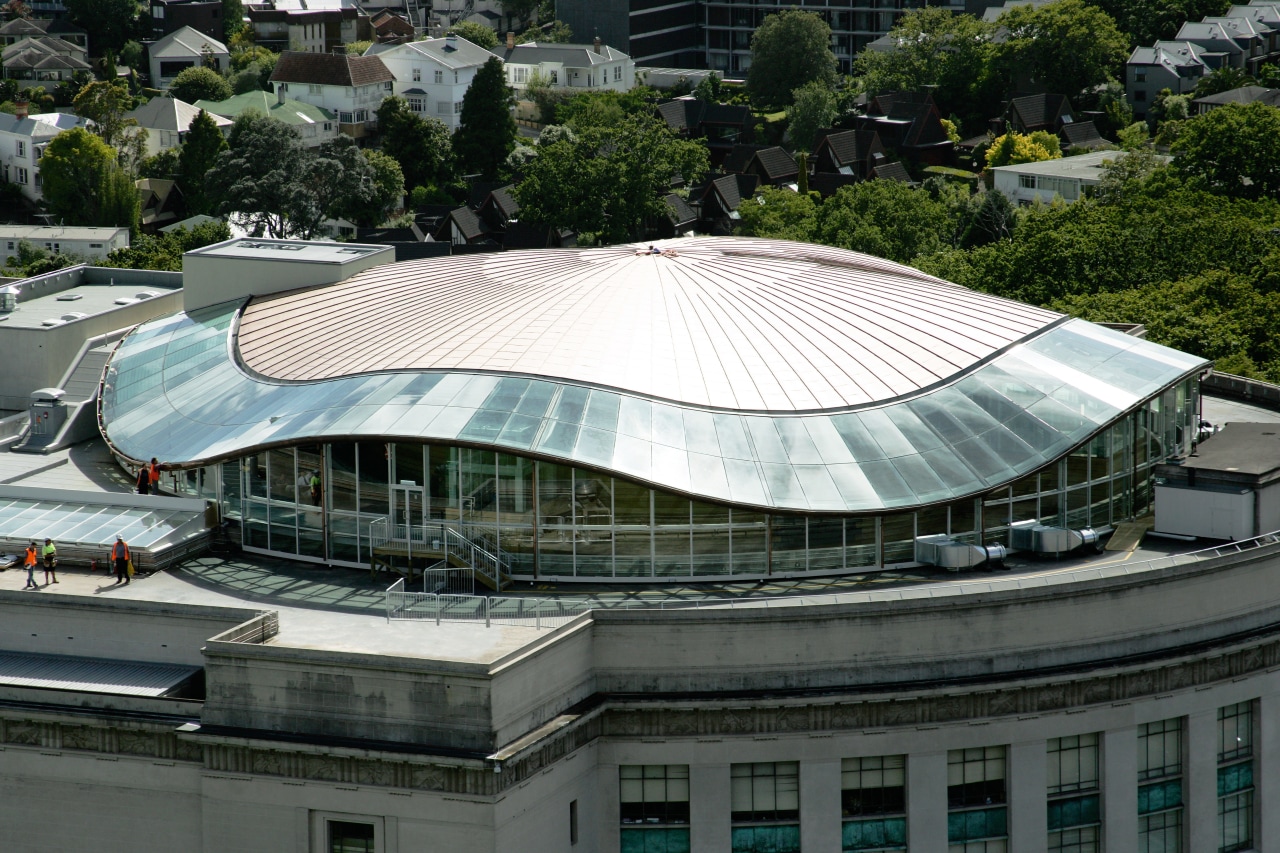 A view of the copper roof installed on architecture, arena, building, corporate headquarters, daylighting, daytime, landmark, metropolitan area, roof, sport venue, stadium, structure, black