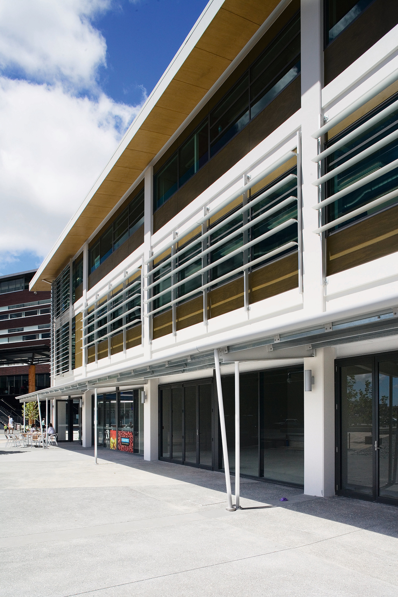 A view of extensive use of elliptical louvres architecture, building, commercial building, corporate headquarters, facade, mixed use, real estate, window, white