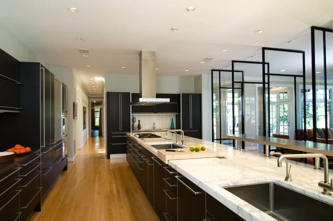 A view of this kitchen featuring maple flooring, countertop, interior design, kitchen, real estate, room, white