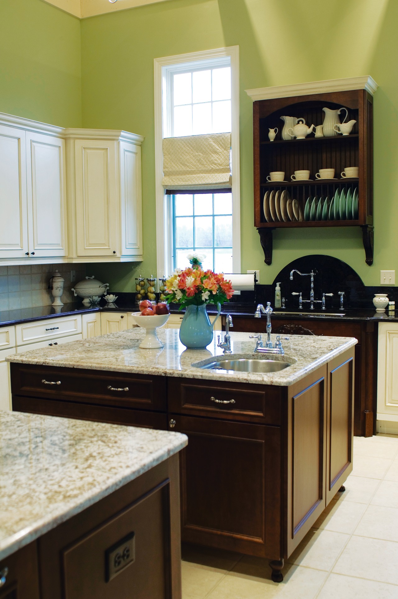 A view of this kitchen featuring tiled flooring, cabinetry, countertop, cuisine classique, hardwood, home, interior design, kitchen, room