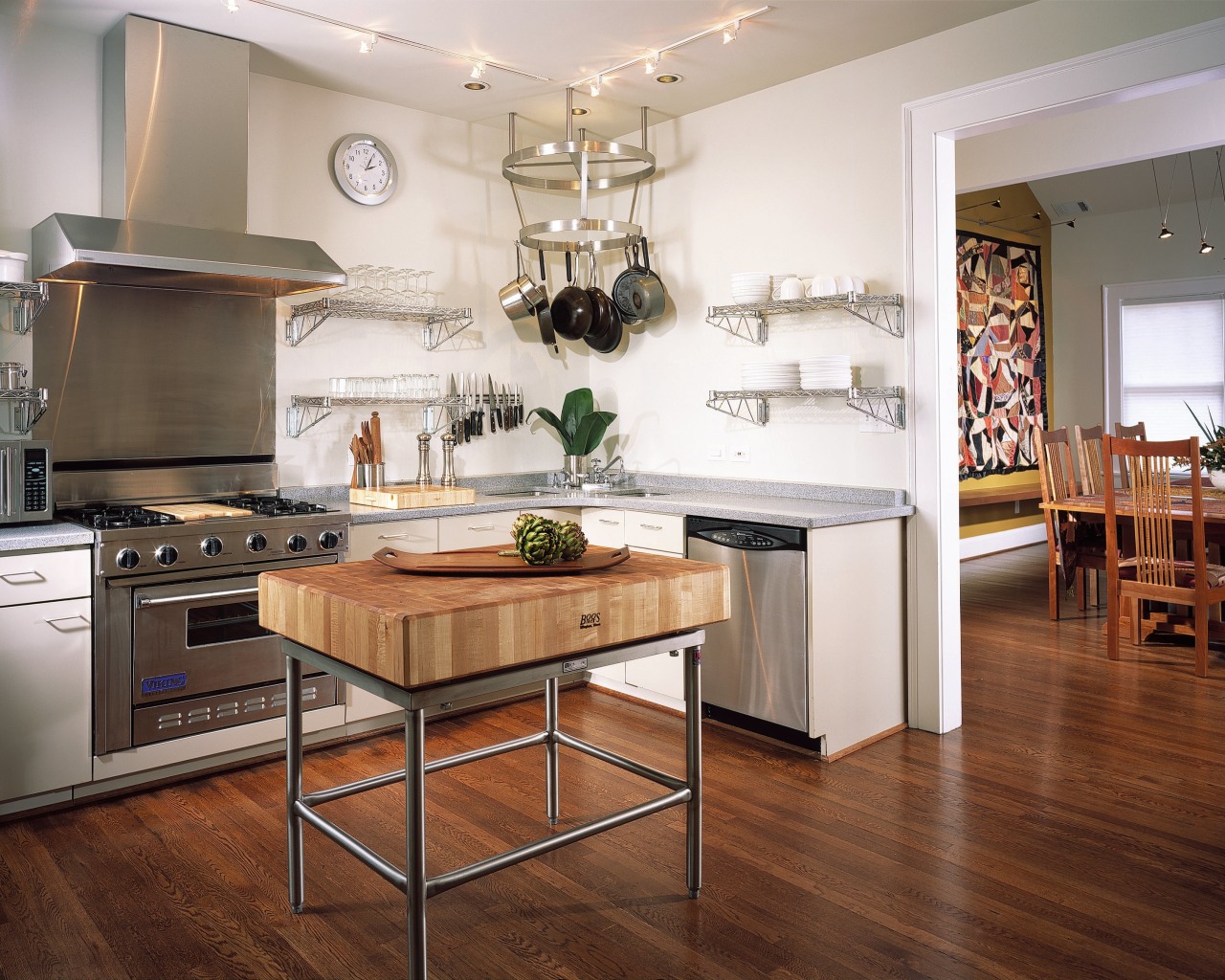 A view of this kitchen featuring stained timber cabinetry, countertop, cuisine classique, floor, flooring, hardwood, interior design, kitchen, laminate flooring, room, wood flooring, white, brown