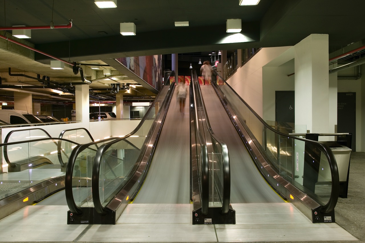 A view of the four moving escalator walkways escalator, brown, black