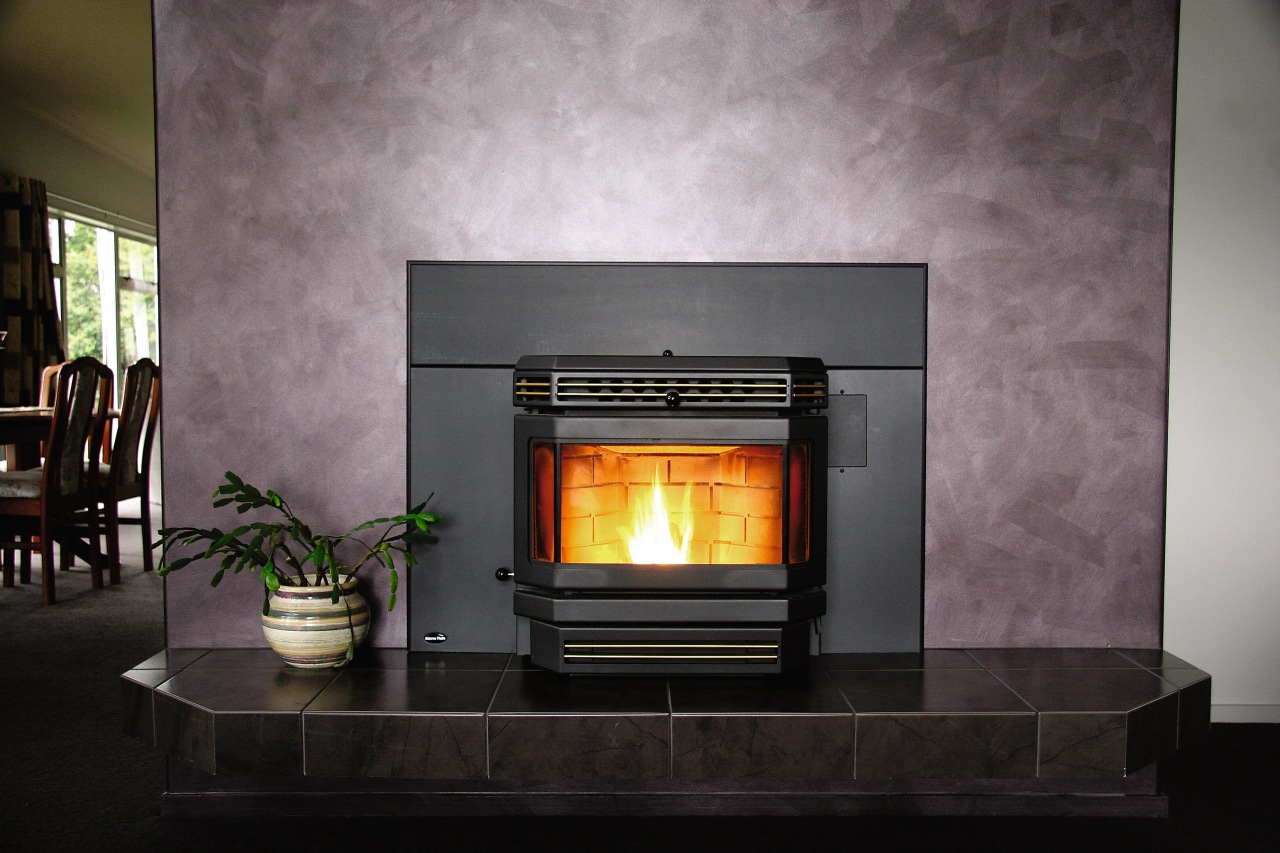 A view of a fireplace from Nature's Flame. fireplace, hearth, heat, home appliance, wood burning stove, gray, black