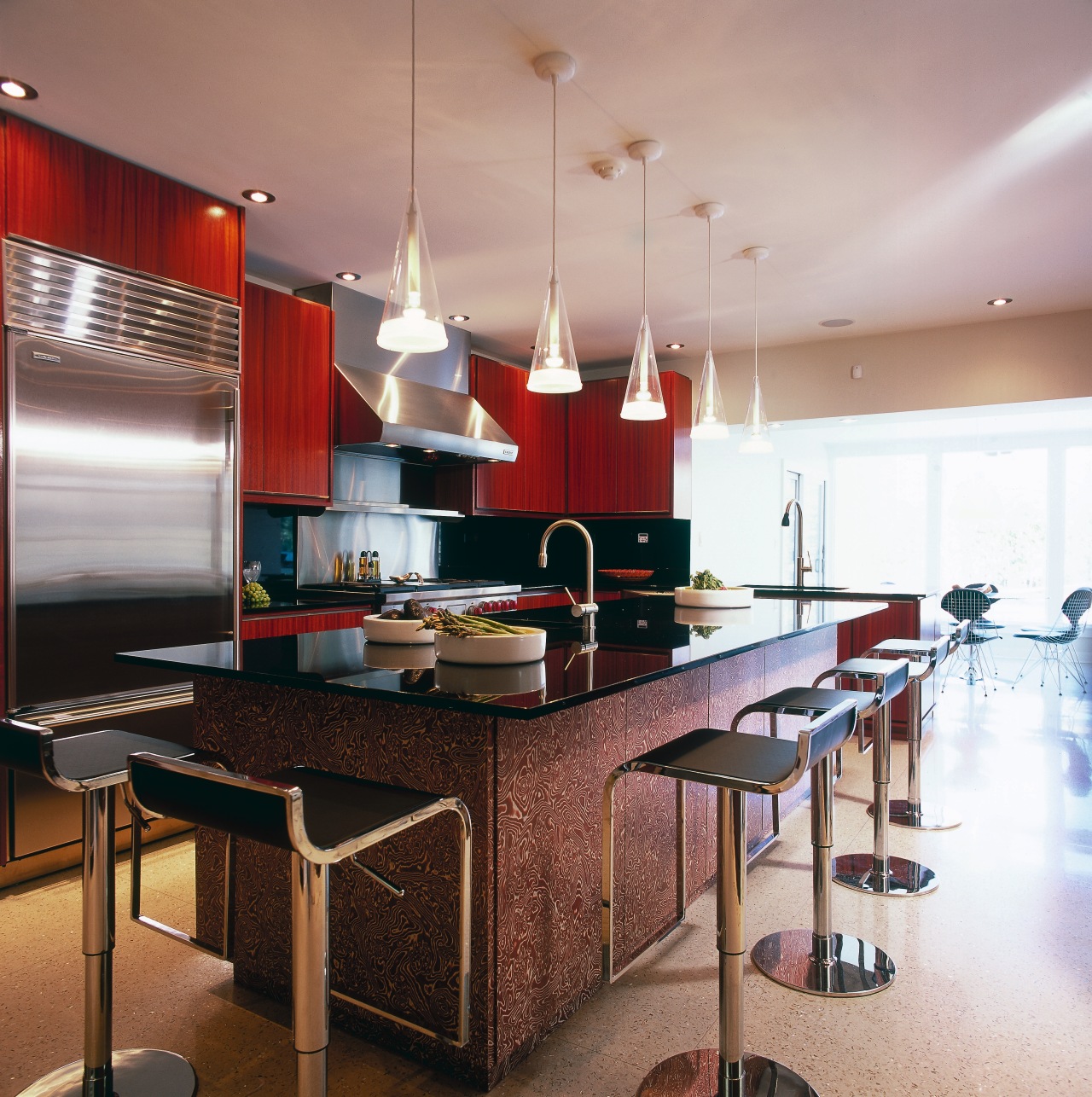 A view of this kitchen featuring terrazzo flooring, cabinetry, ceiling, countertop, interior design, kitchen, room, table, gray