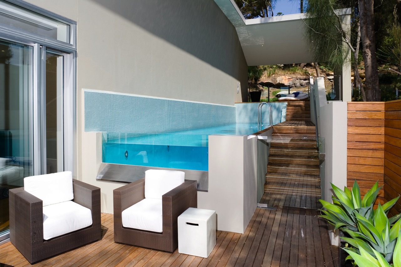 A view of a home developed by Lend architecture, furniture, house, interior design, property, swimming pool, table, gray