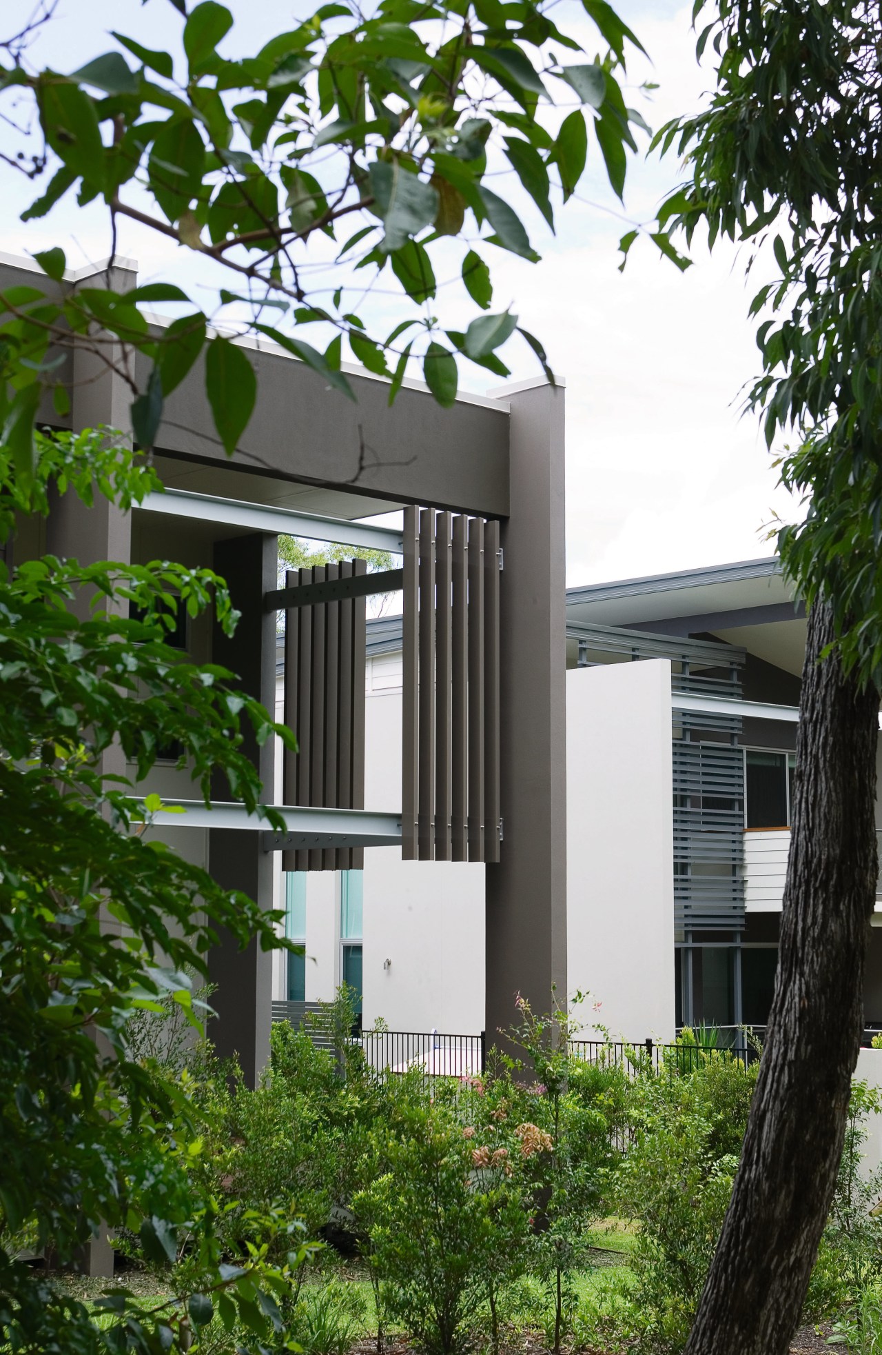 A view of some balustrades from Aluminium Balustrades. architecture, building, facade, home, house, tree, white