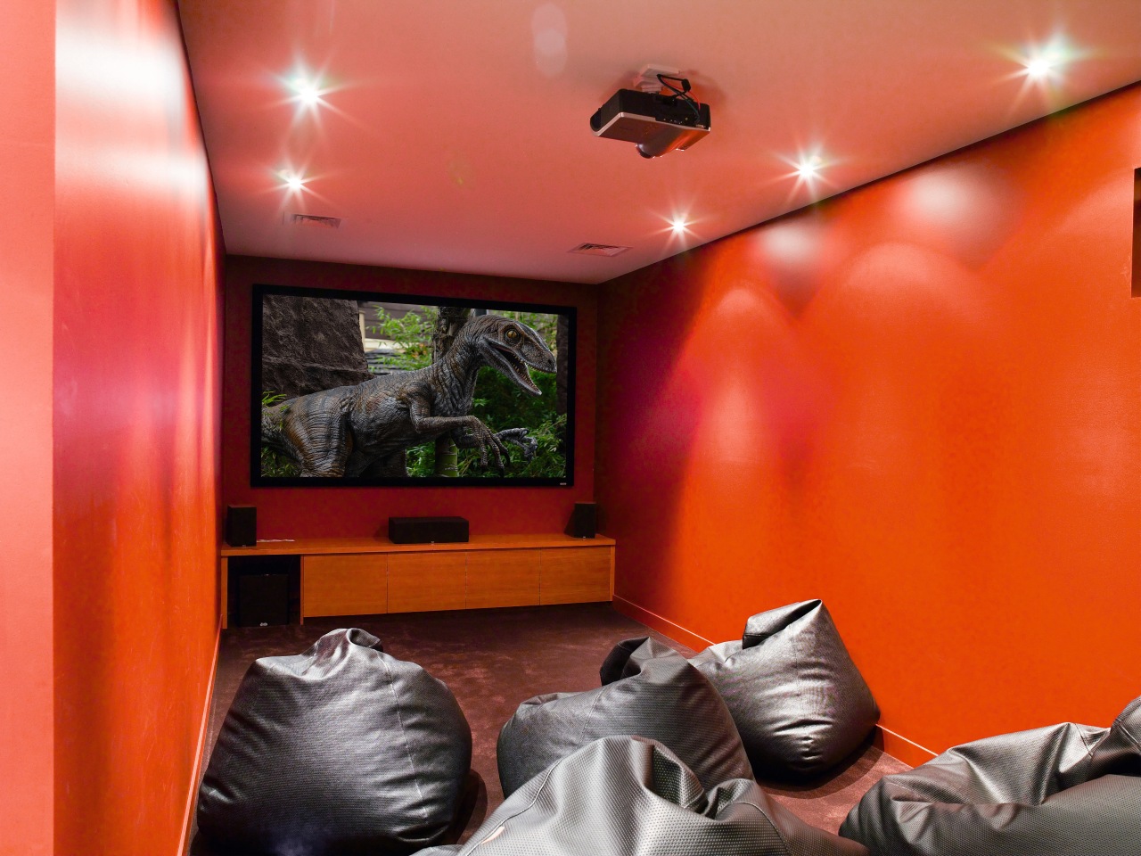 A view of an home theatre system witch ceiling, home, interior design, orange, room, wall, red