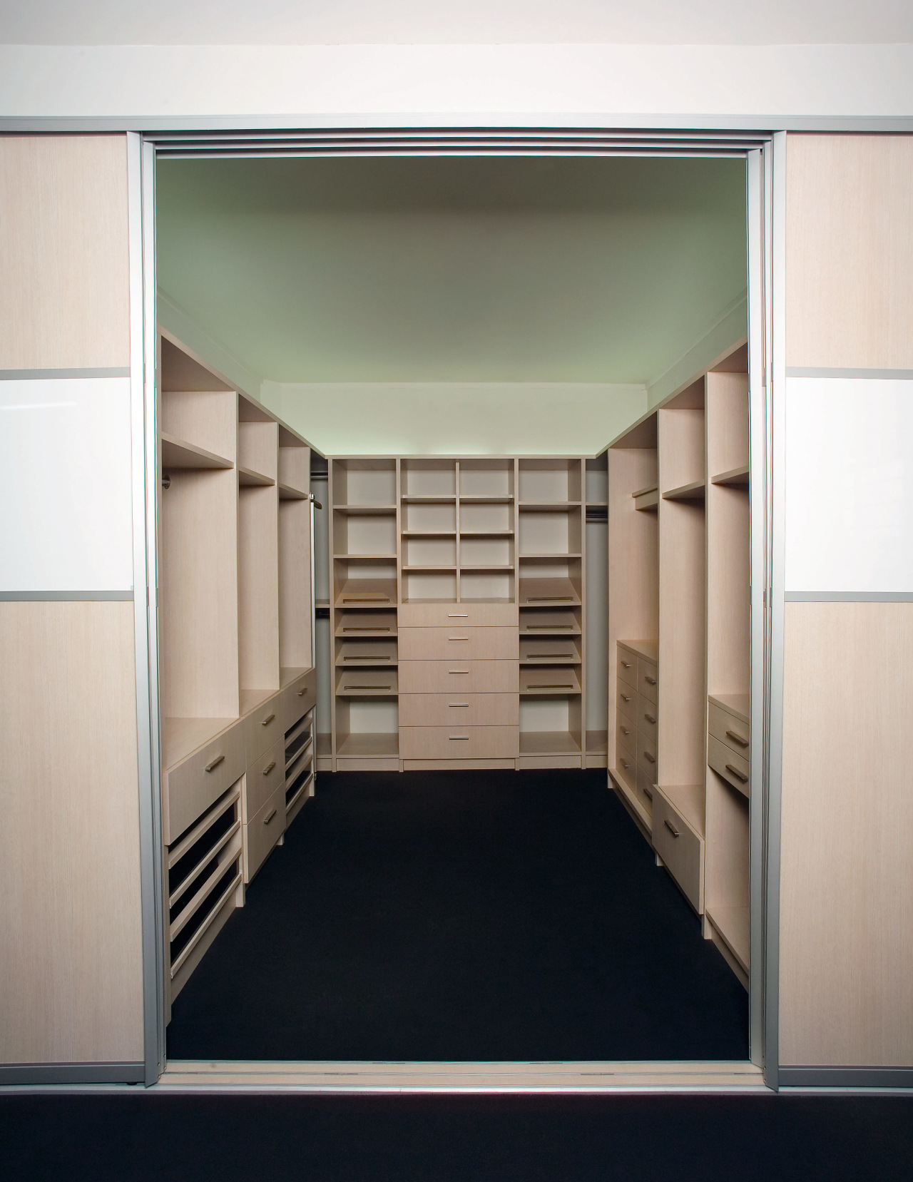 A view of the Walk in wardrobe featuring cabinetry, closet, cupboard, furniture, wardrobe, white