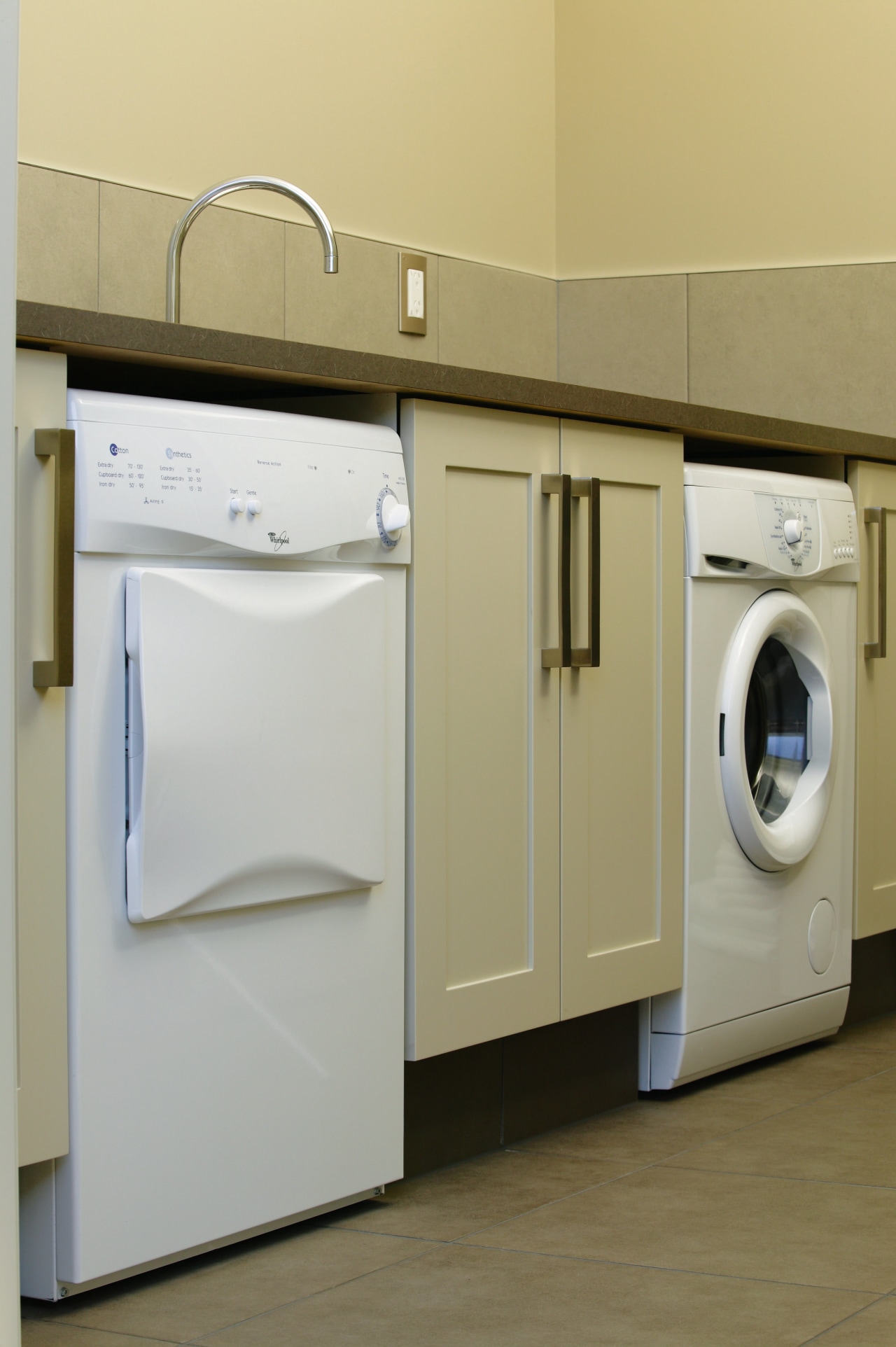 A view of some laundry appliances from Whirlpool. clothes dryer, home appliance, laundry, laundry room, major appliance, product, product design, room, washing machine, gray, brown