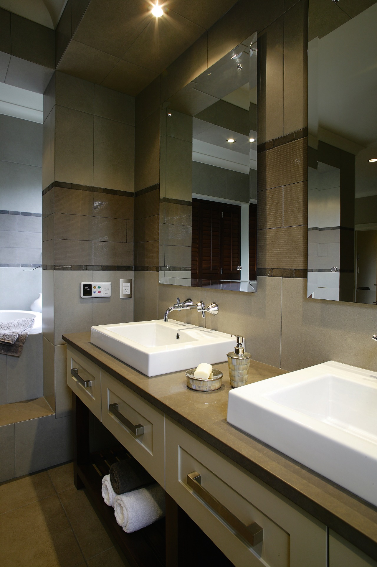 A view of the bathroom featuriing underfloor heating, architecture, bathroom, countertop, interior design, room, sink, brown