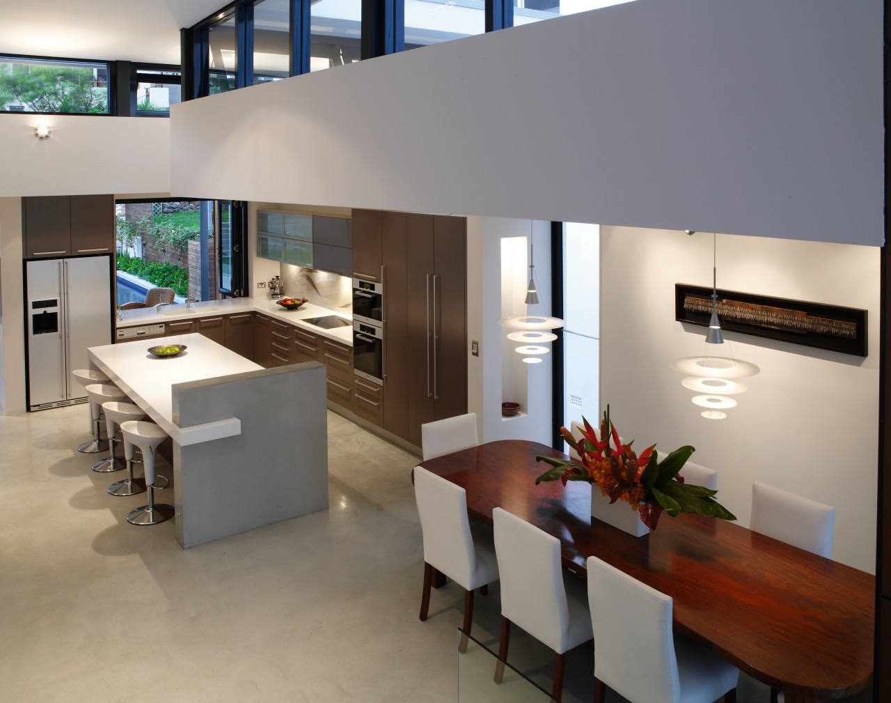 A view of the kitchen area featuring polished furniture, interior design, living room, product design, table, gray