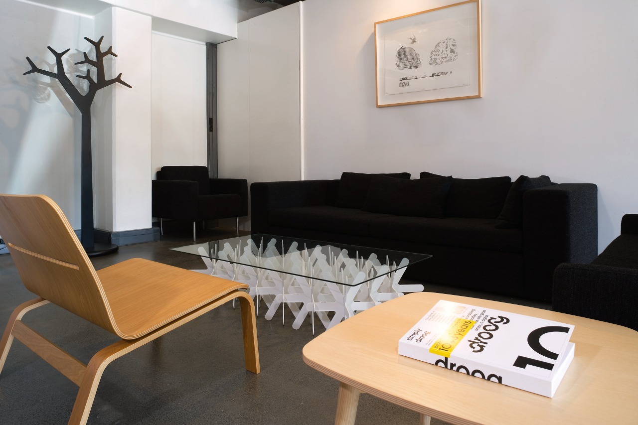 view of this apartment living area featuring clack chair, couch, furniture, interior design, living room, product design, property, room, table, waiting room, gray, black