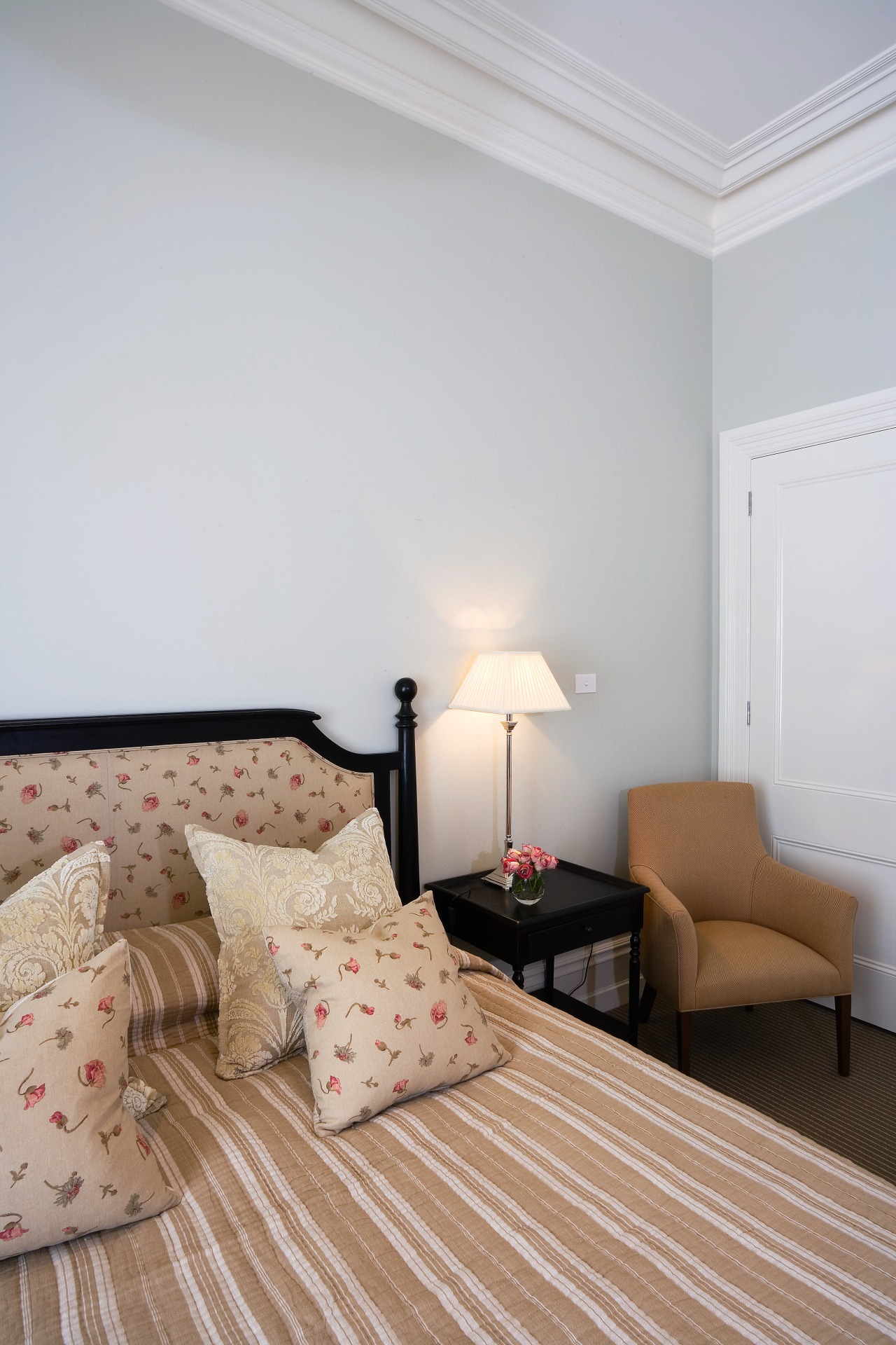 A view of this bedroom featuring carpet flooring, bed frame, bedroom, ceiling, floor, flooring, home, interior design, living room, real estate, room, suite, wall, wood, gray