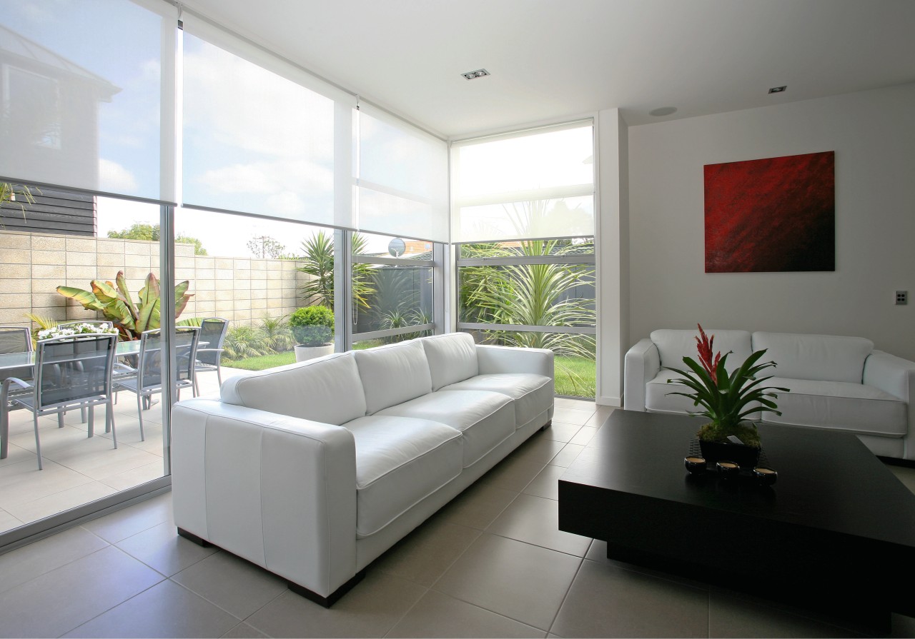 A view of these living areas featuring stained architecture, floor, interior design, living room, property, real estate, window, white, gray