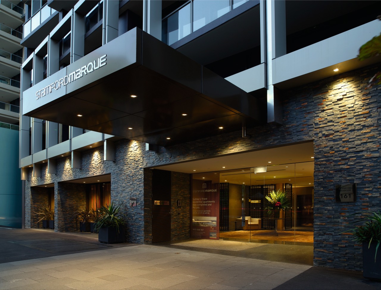 An exterior view of the Stamford Marque apartment architecture, building, condominium, facade, house, mixed use, real estate, black