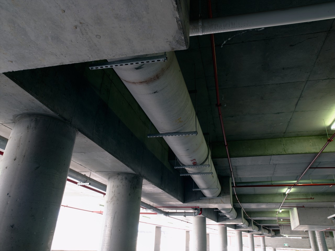 A view of the hydraulic system that incorporates aerospace engineering, airplane, architecture, aviation, beam, ceiling, pipe, steel, structure, black, gray