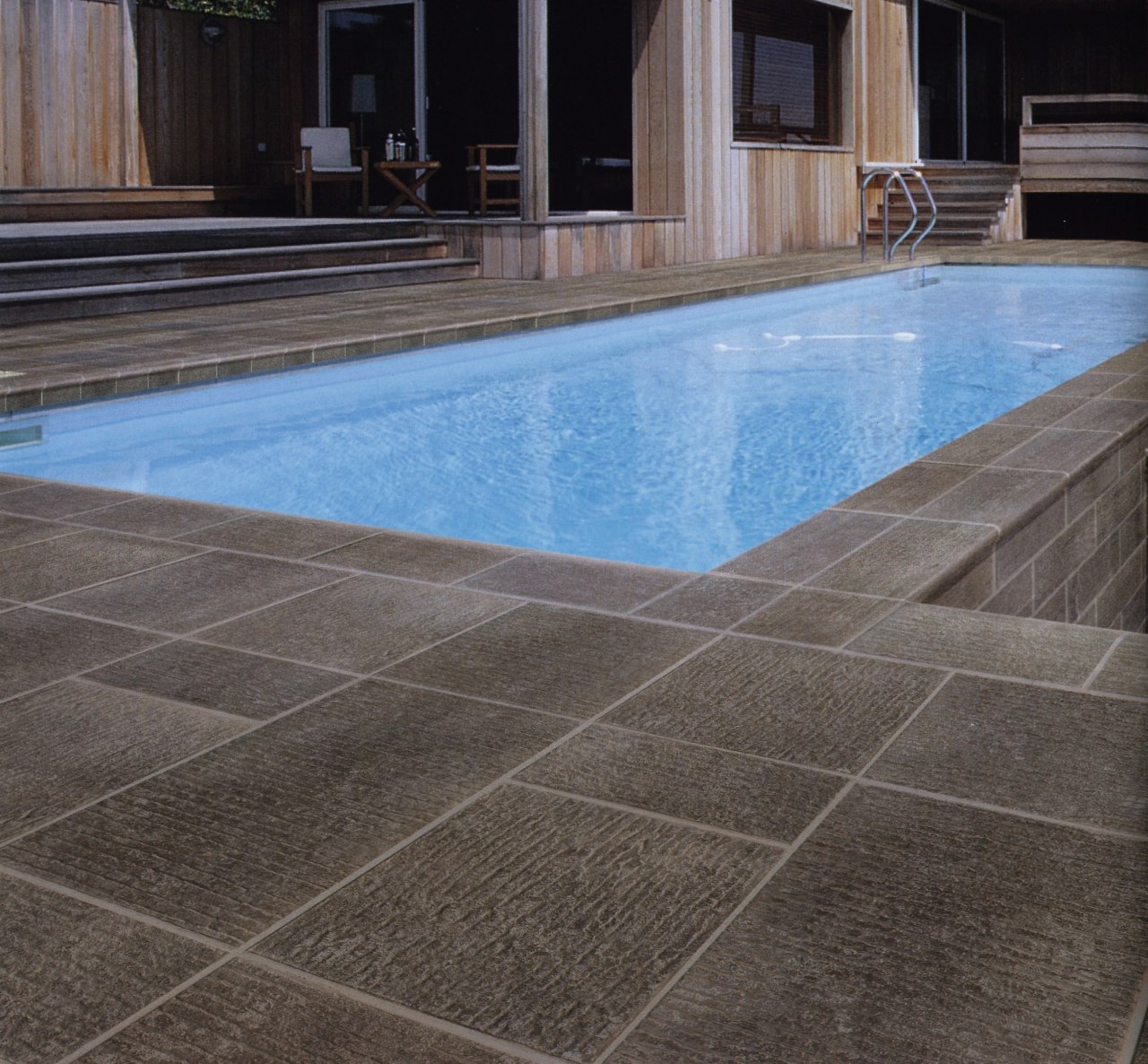 Textured ceramic Urban Life pavers are hard wearing, floor, flooring, hardwood, property, swimming pool, tile, wall, wood, gray, black